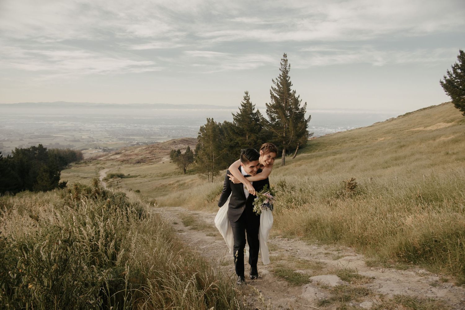 Piggy back wedding photo