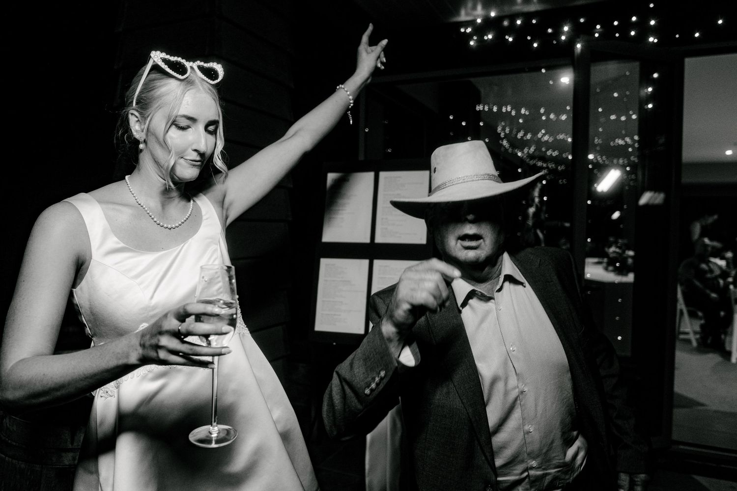 Bride partying with guests at Waipuna Estate - fun wedding photography New Zealand.