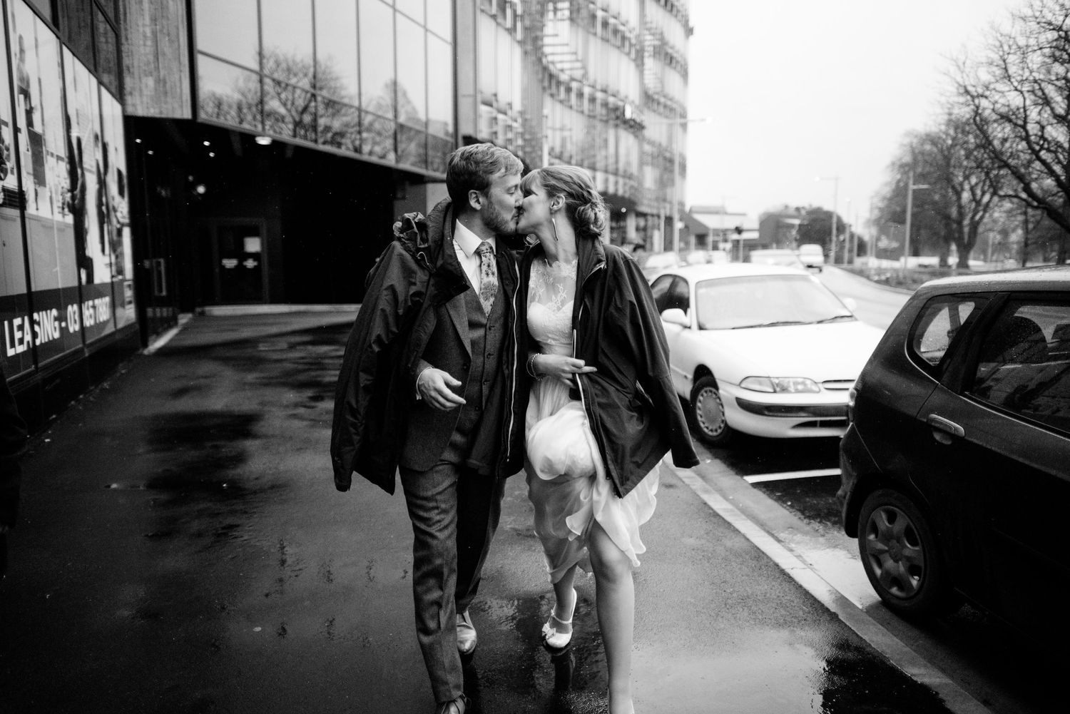 Walking down central Chch for a raining wedding
