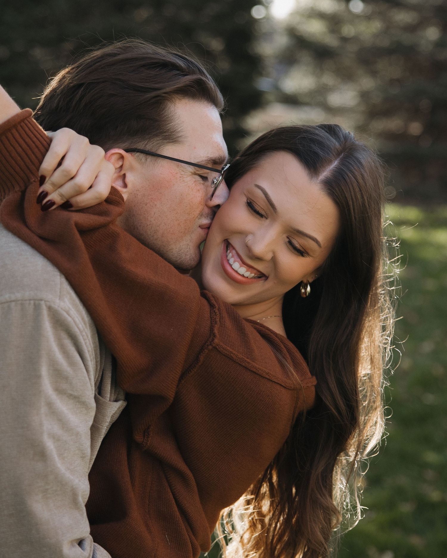 Close-up of couple laughing together during portrait session
