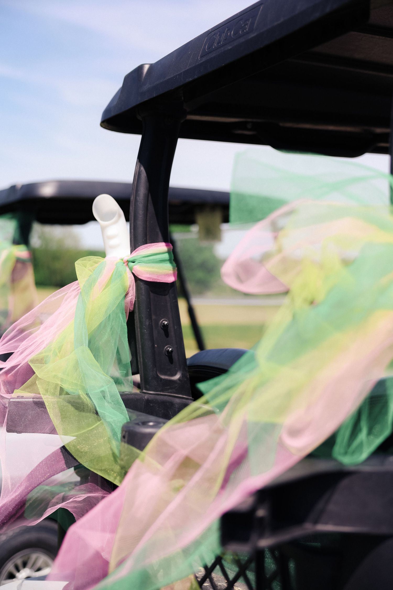 close up details of color and accessories at golf charity event