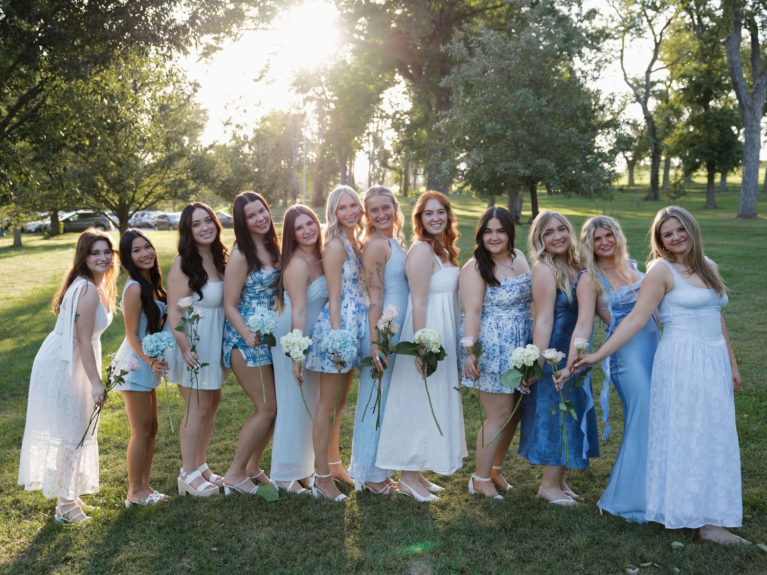 candid bright and colorful sorority group with flowers