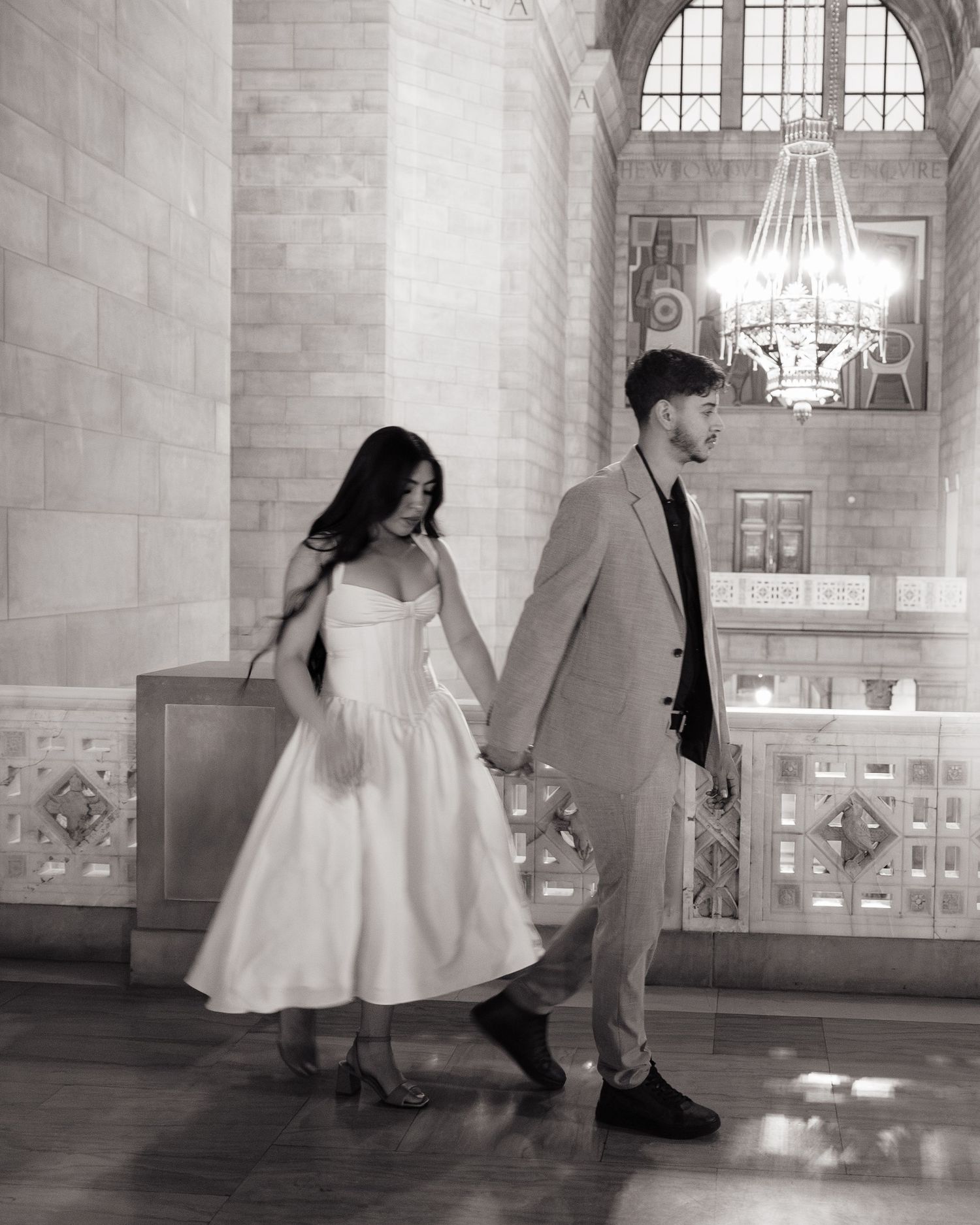 Dramatic couples shoot, walking hand in hand during portrait session
