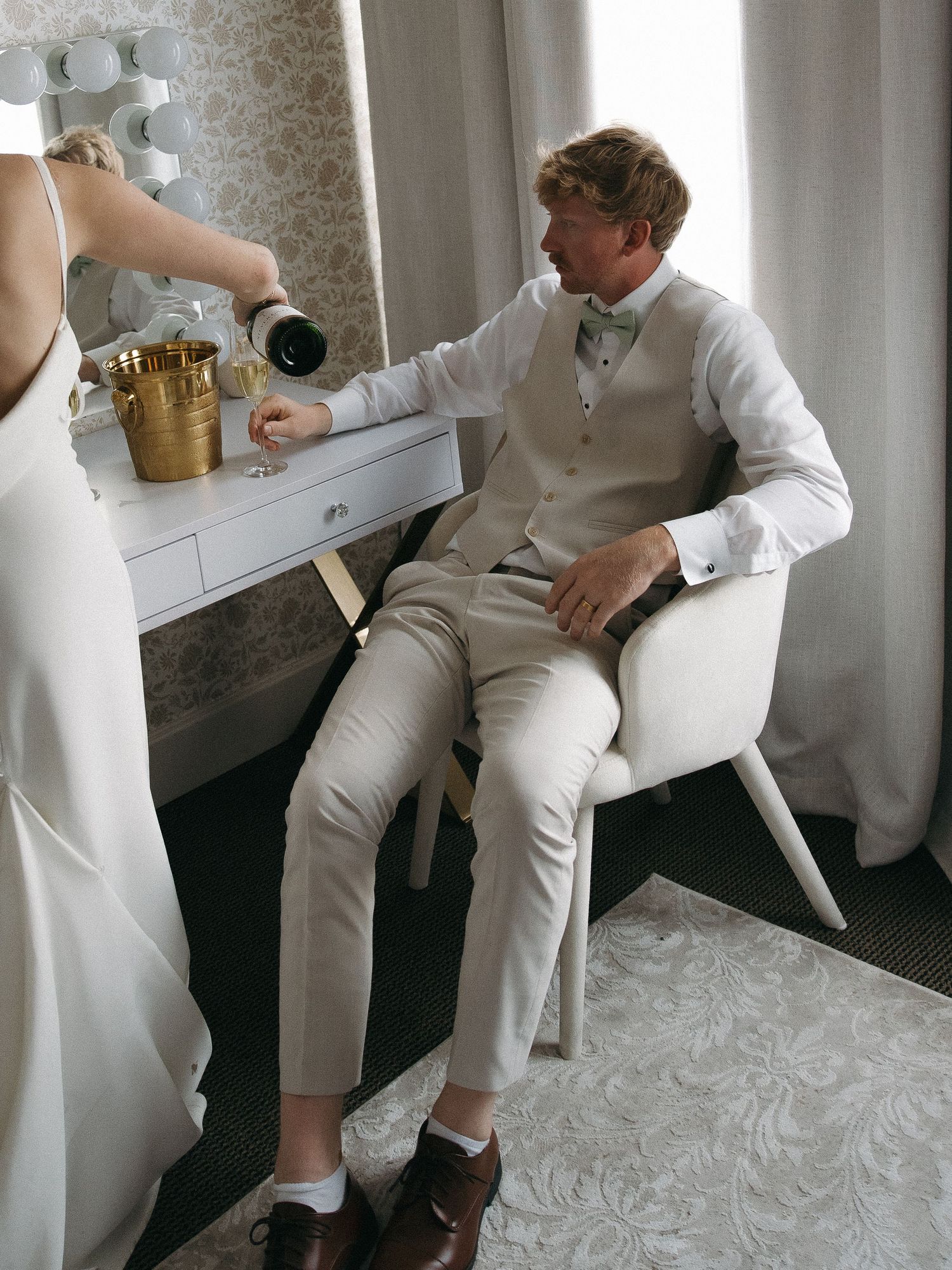 bride and groom candidly relaxing before reception
