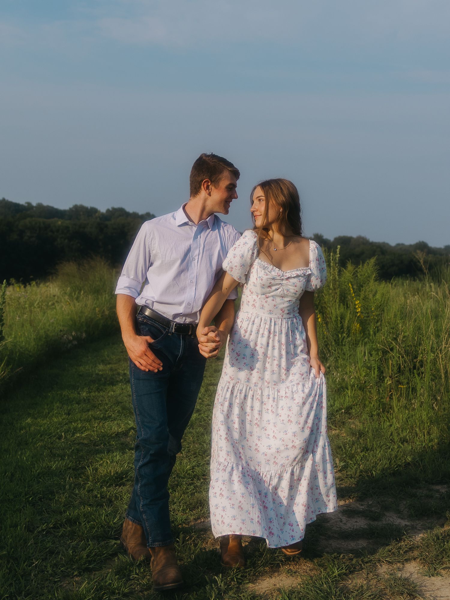 Engagement portrait with couple standing side by side