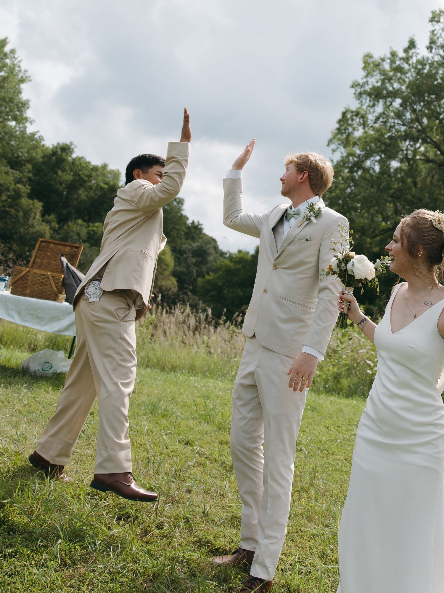 groom and groomsmen high five