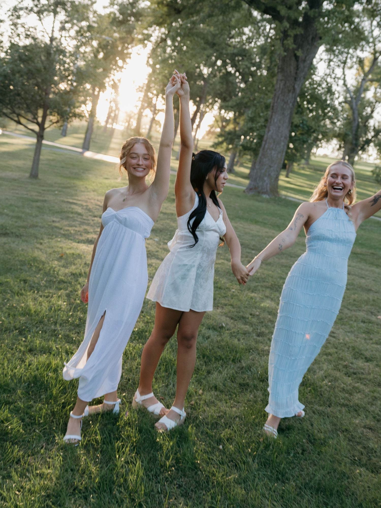 sorority members candidly laughing and smiling in golden hour