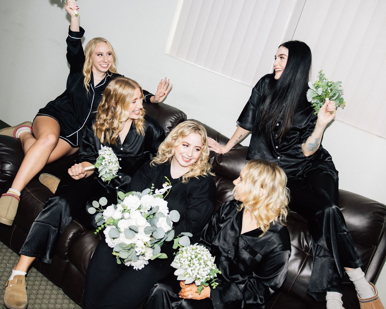 candid photograph of bridesmaids getting ready