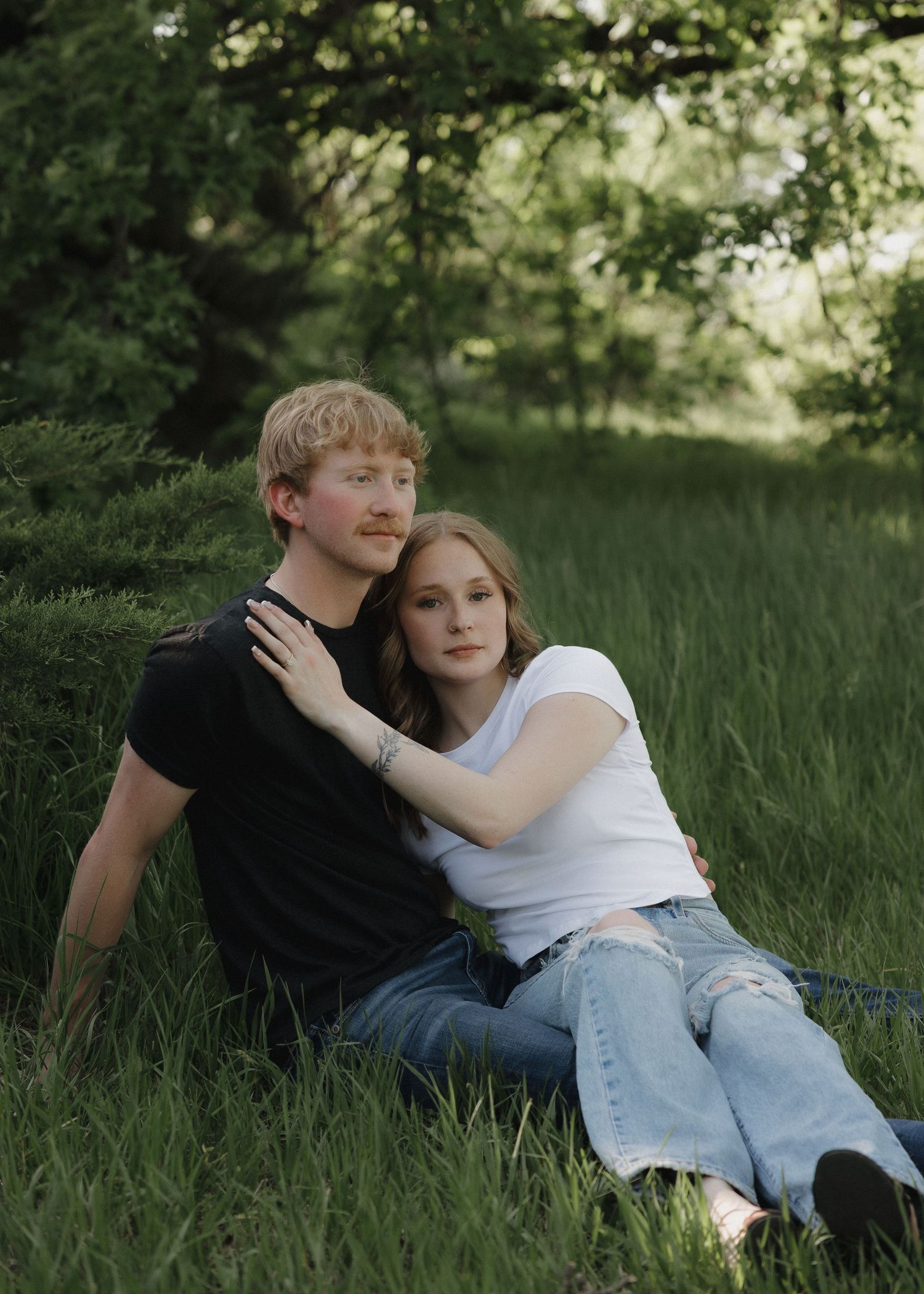 dramatic hugging in grass during golden hour
