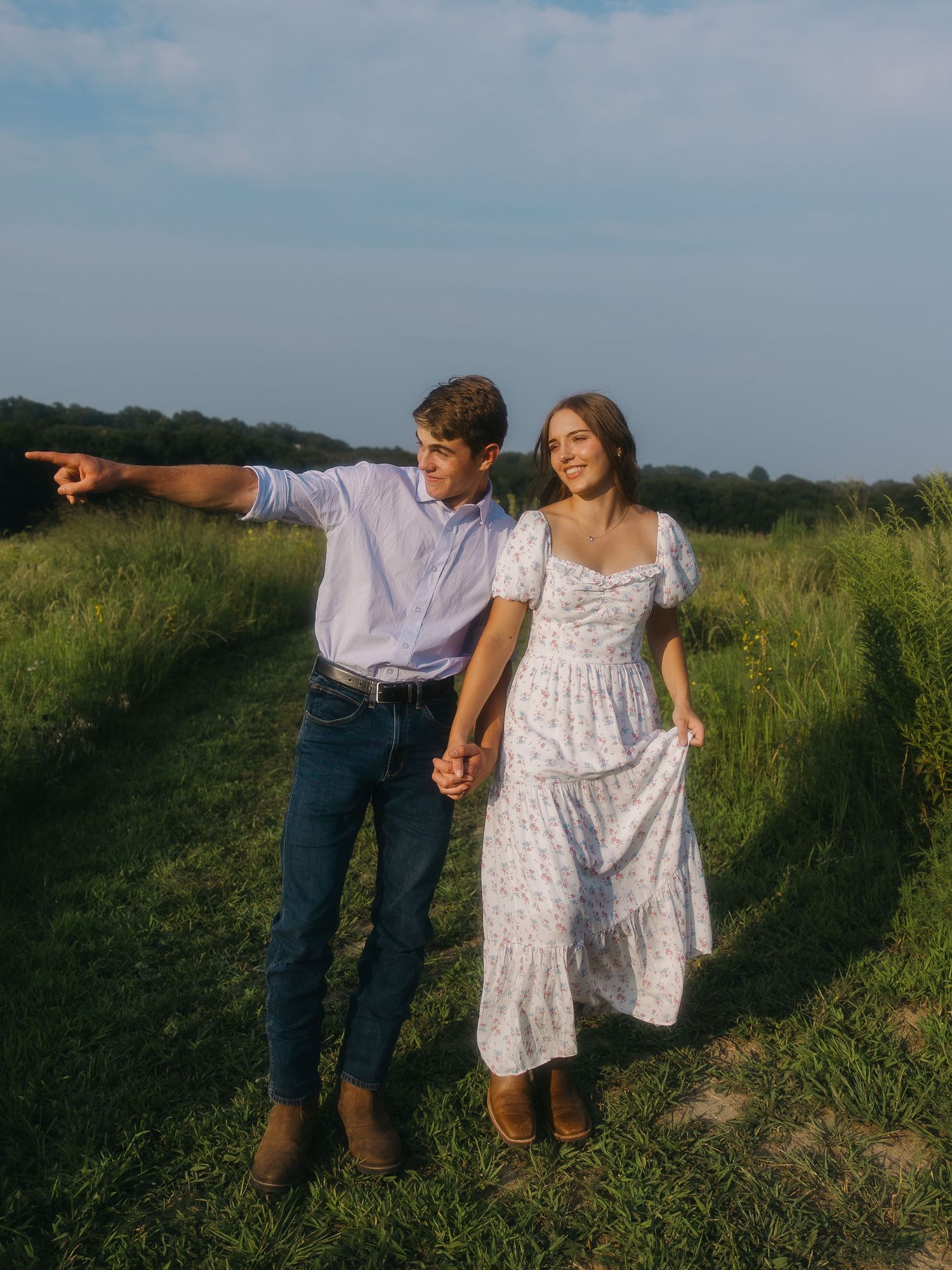 Couple standing close together during outdoor engagement session