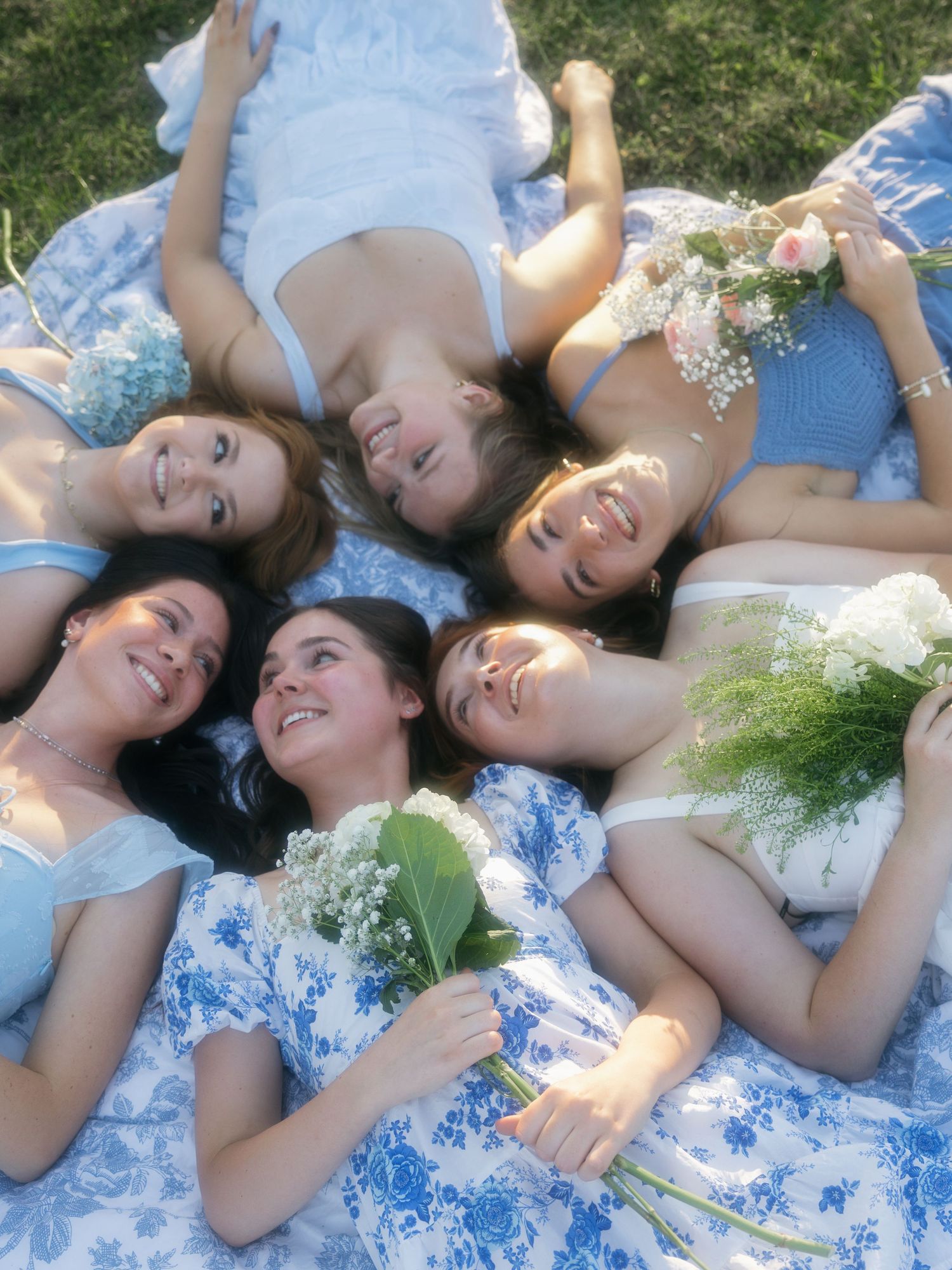 smiling candid sorority group with flowers