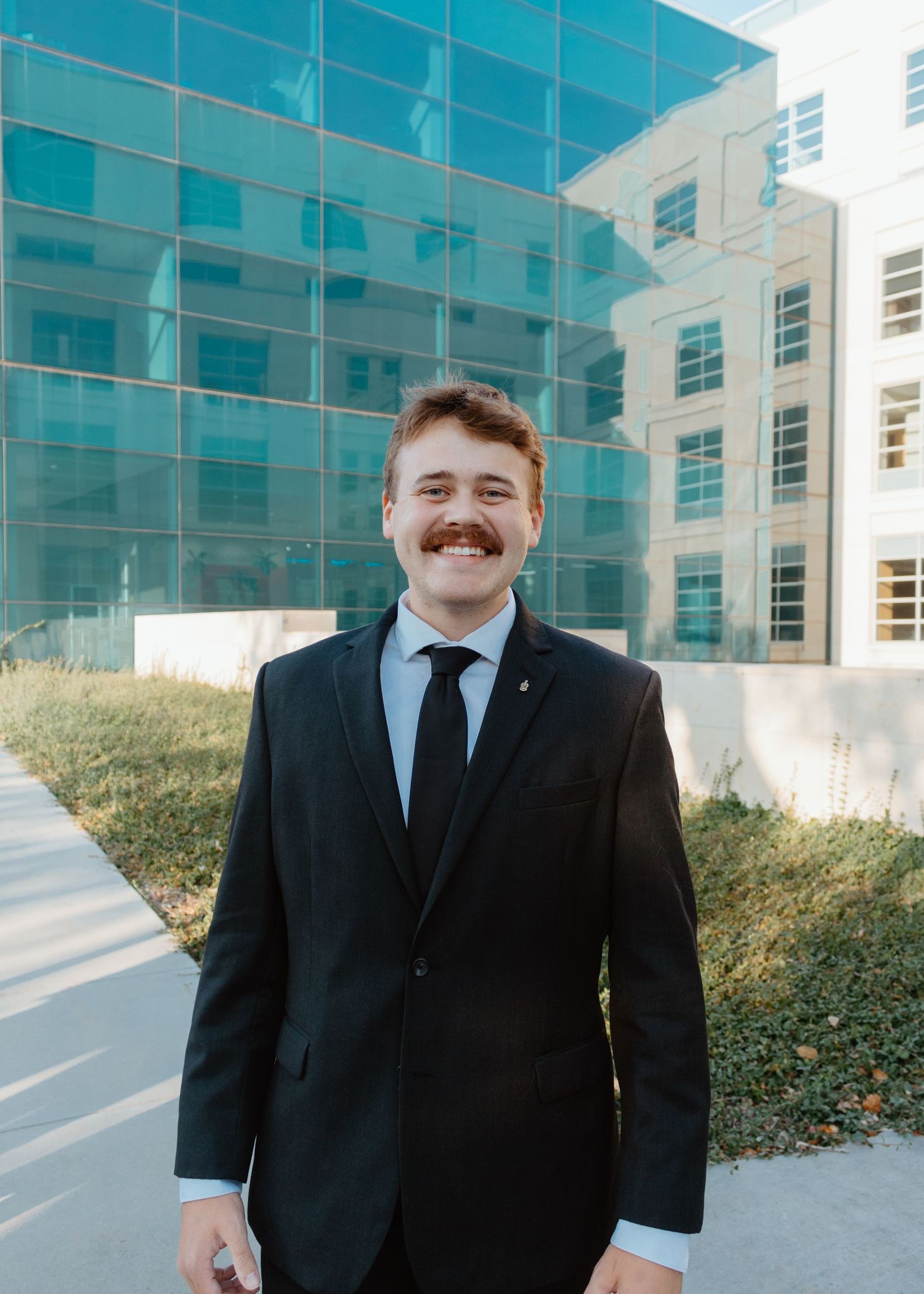 Corporate clean business headshot in outdoor professional setting