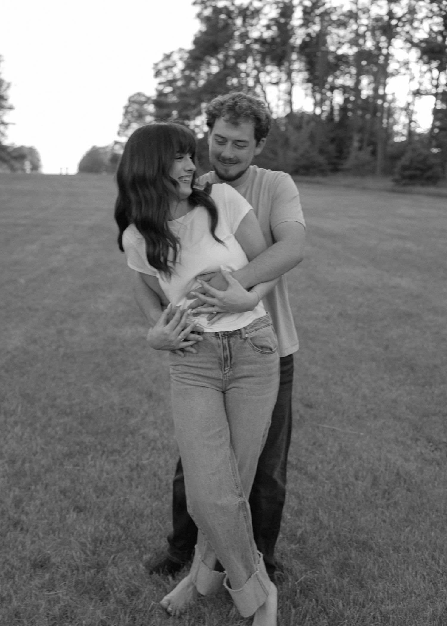 candid couple laughing outdoor engagement session