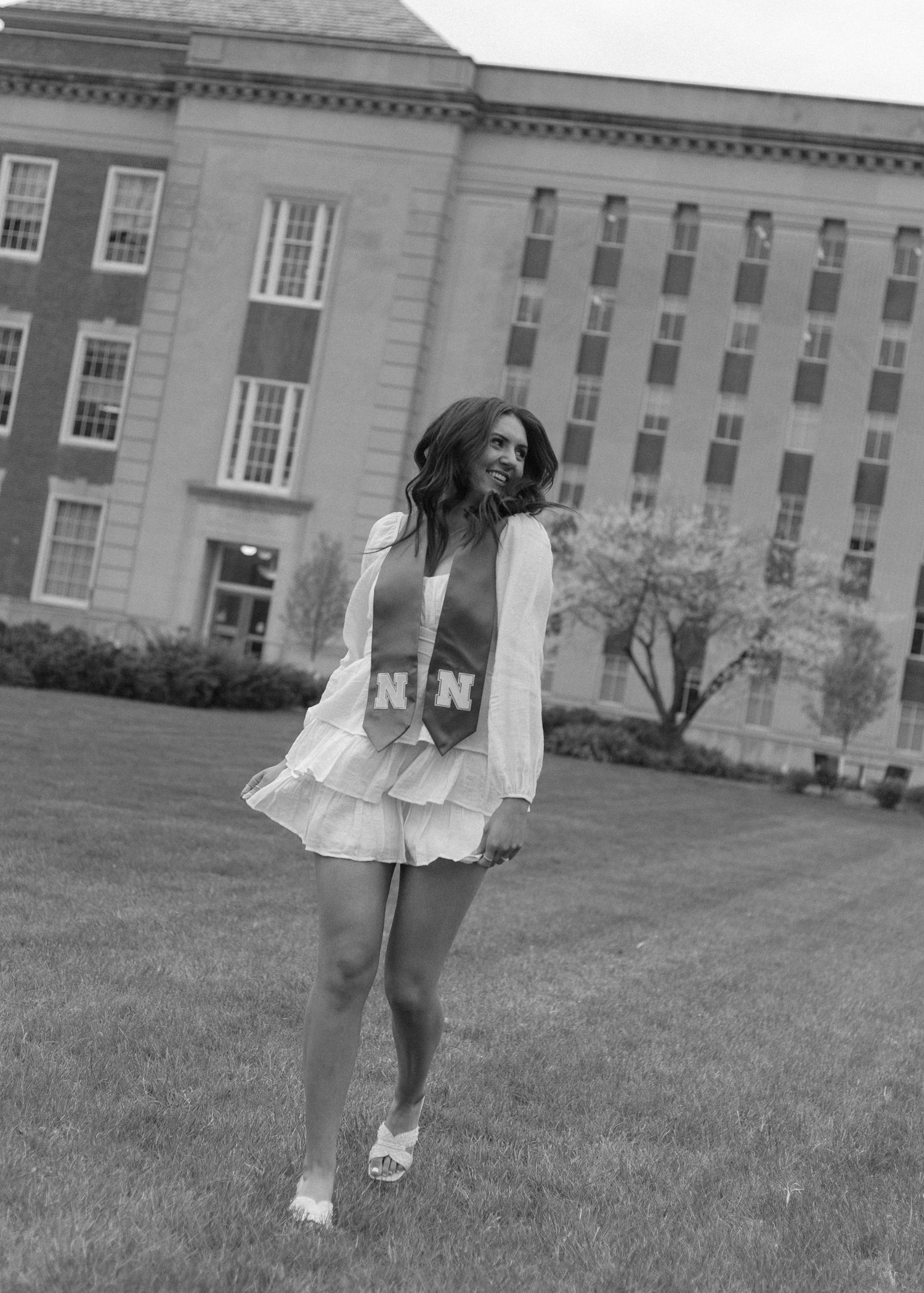 Confident graduate portrait with relaxed energy