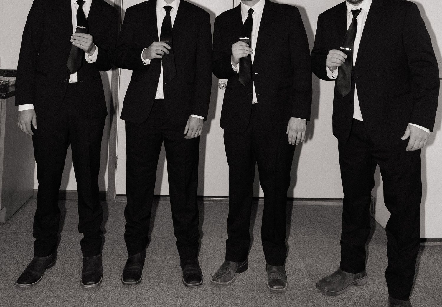 flash photograph of groomsmen getting ready