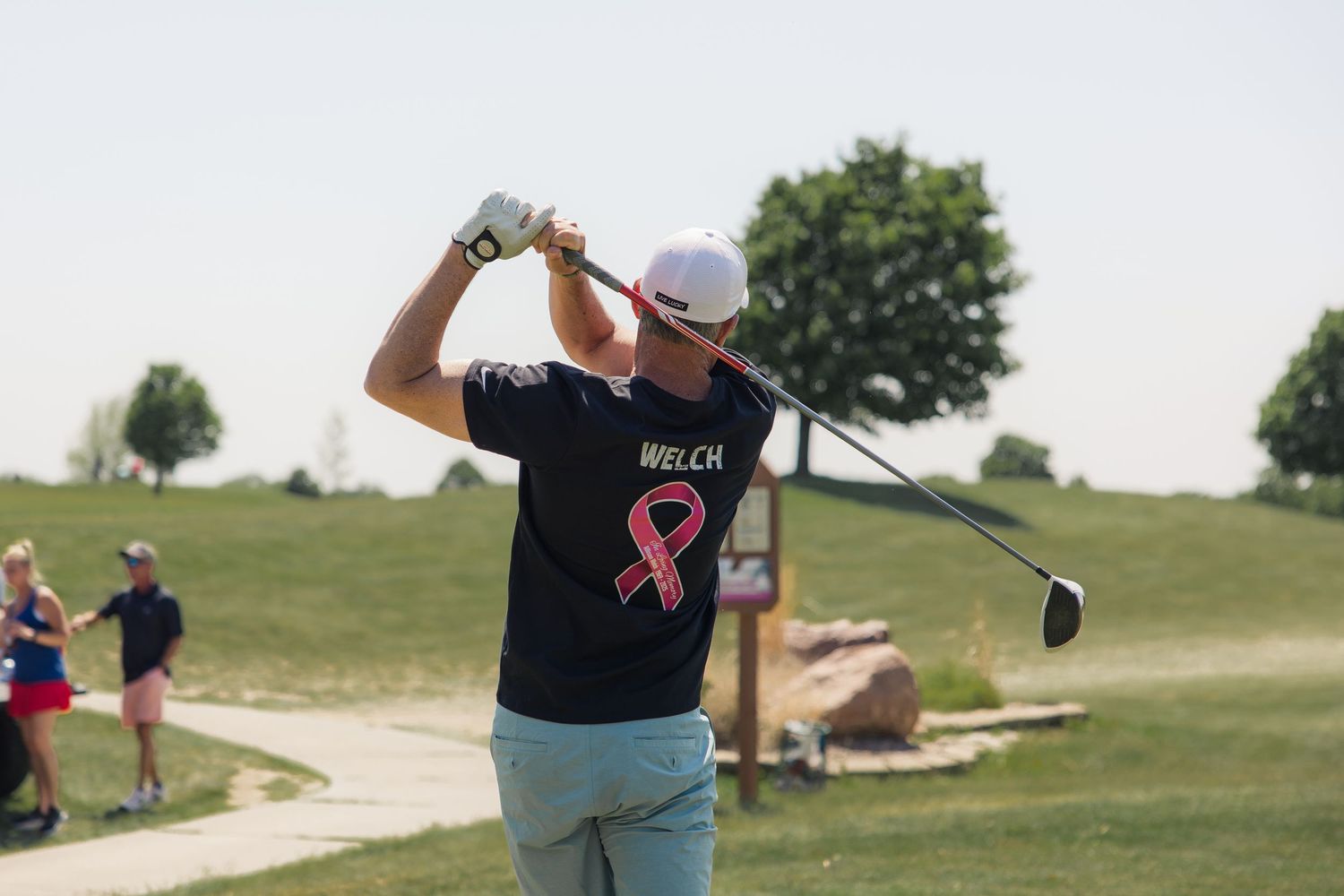 natural and bright golf swing at charity event