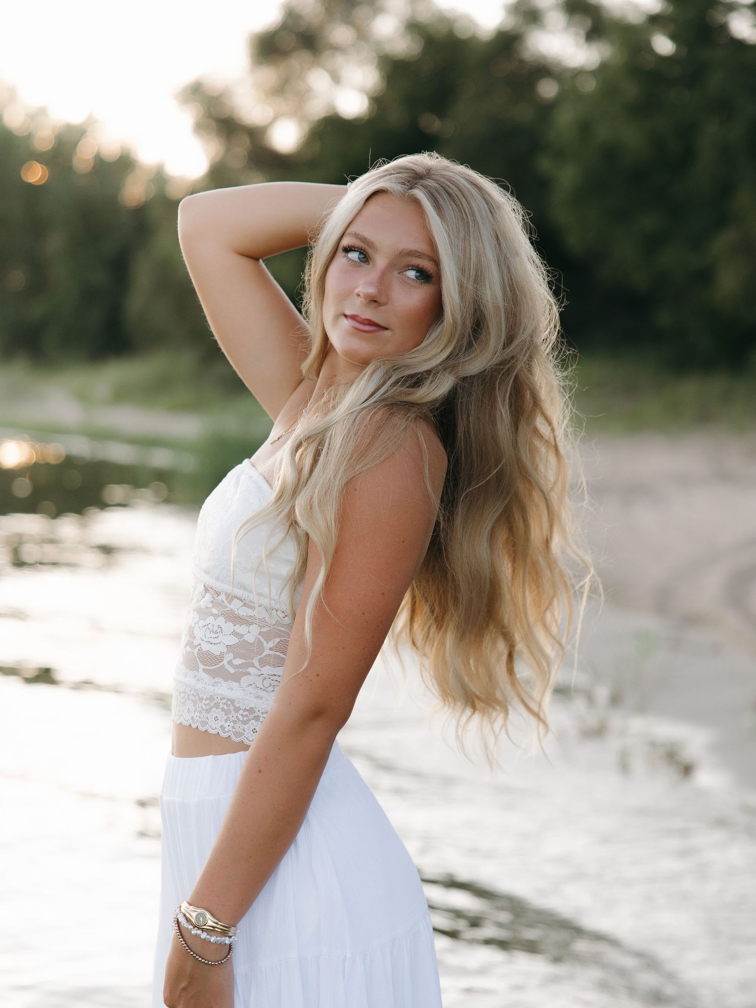 outdoor lake graduation photoshoot with water