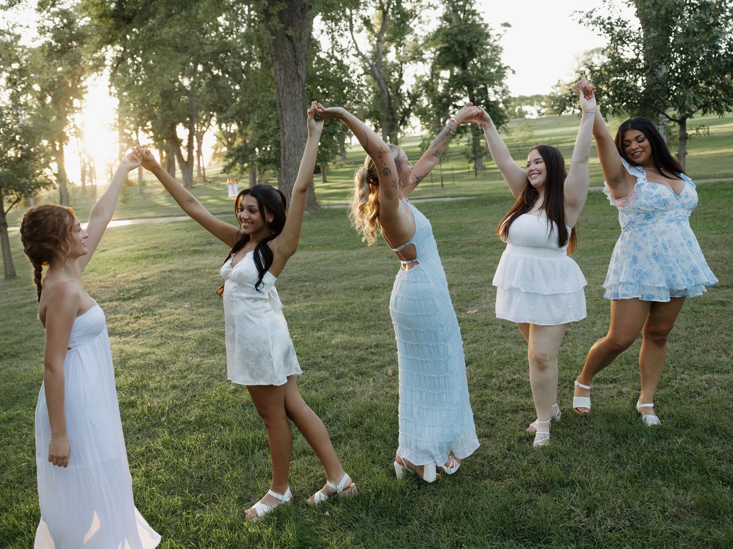 sorority members candidly smiling in golden hour