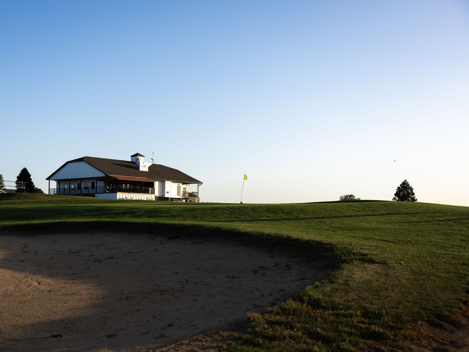 landscape of golf course real estate photo at golden hour