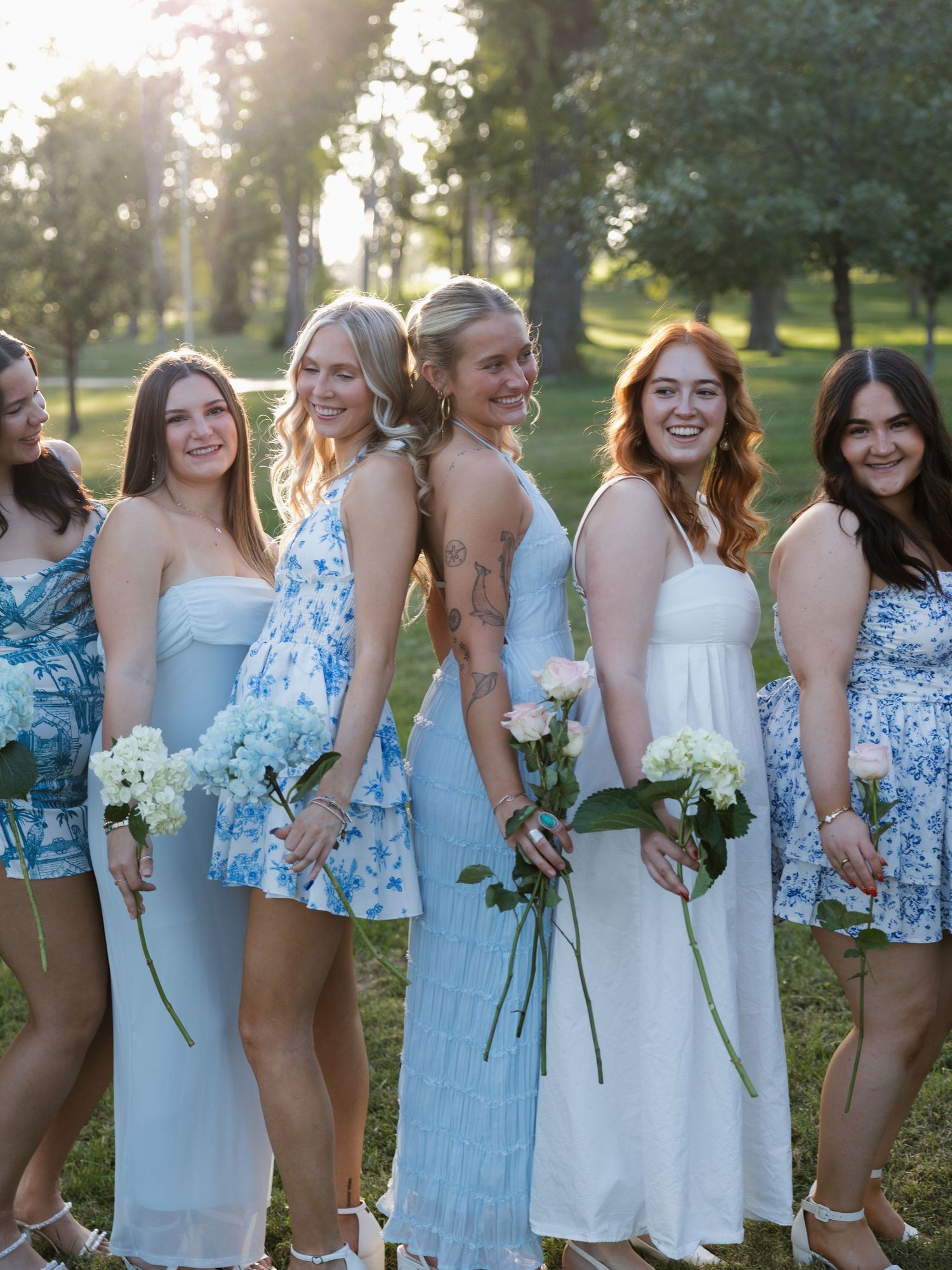 candid bright and colorful sorority group with flowers