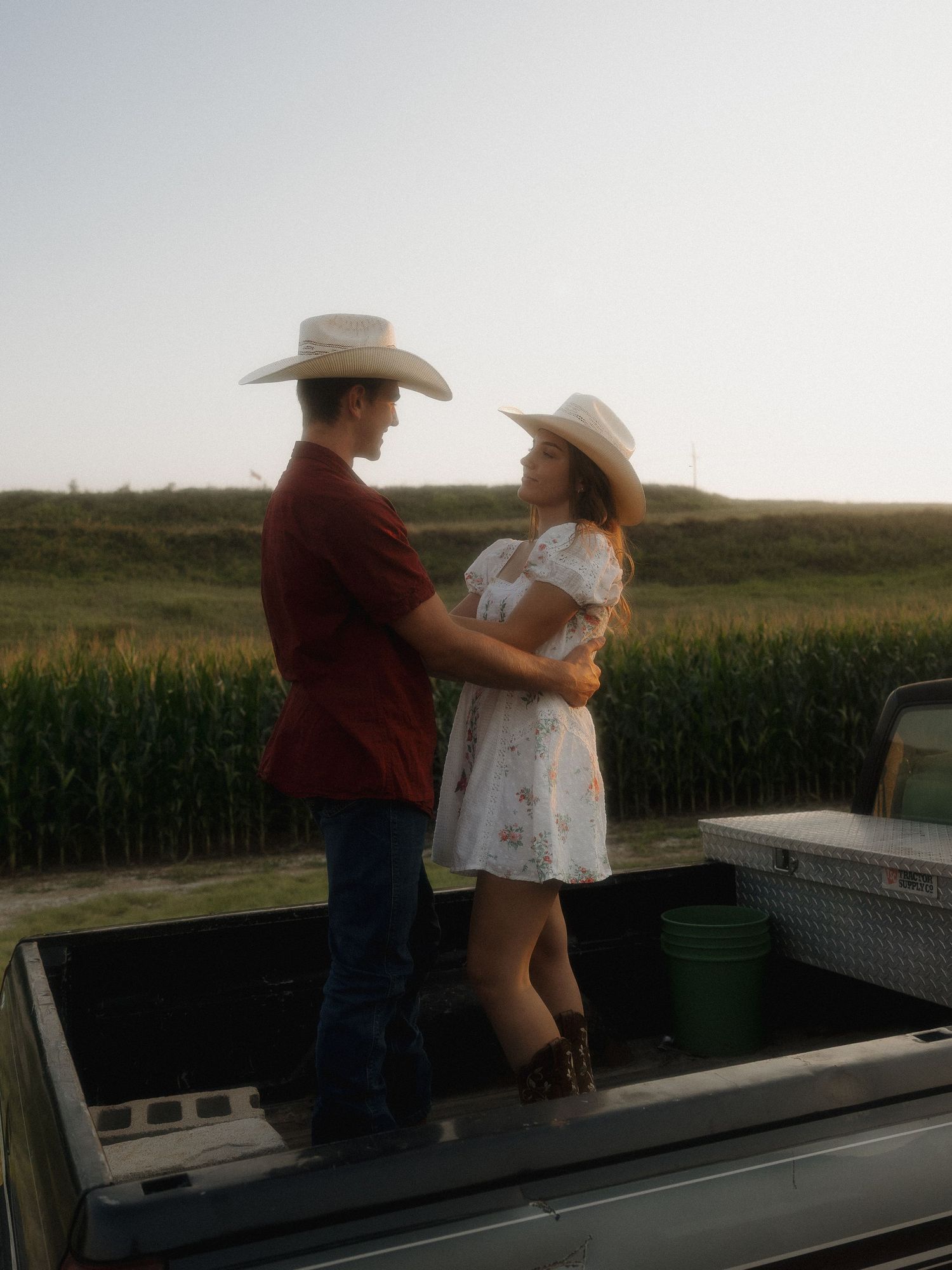 A couple hugging with dreamy golden hour light