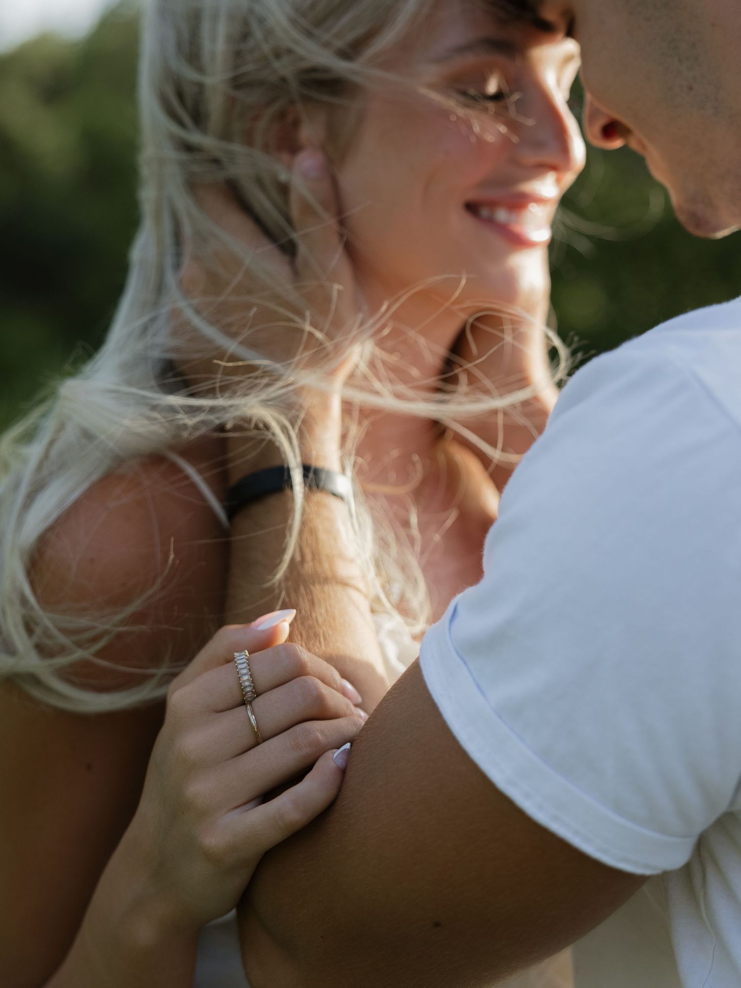 Engaged couple forehead-to-forehead during intimate moment