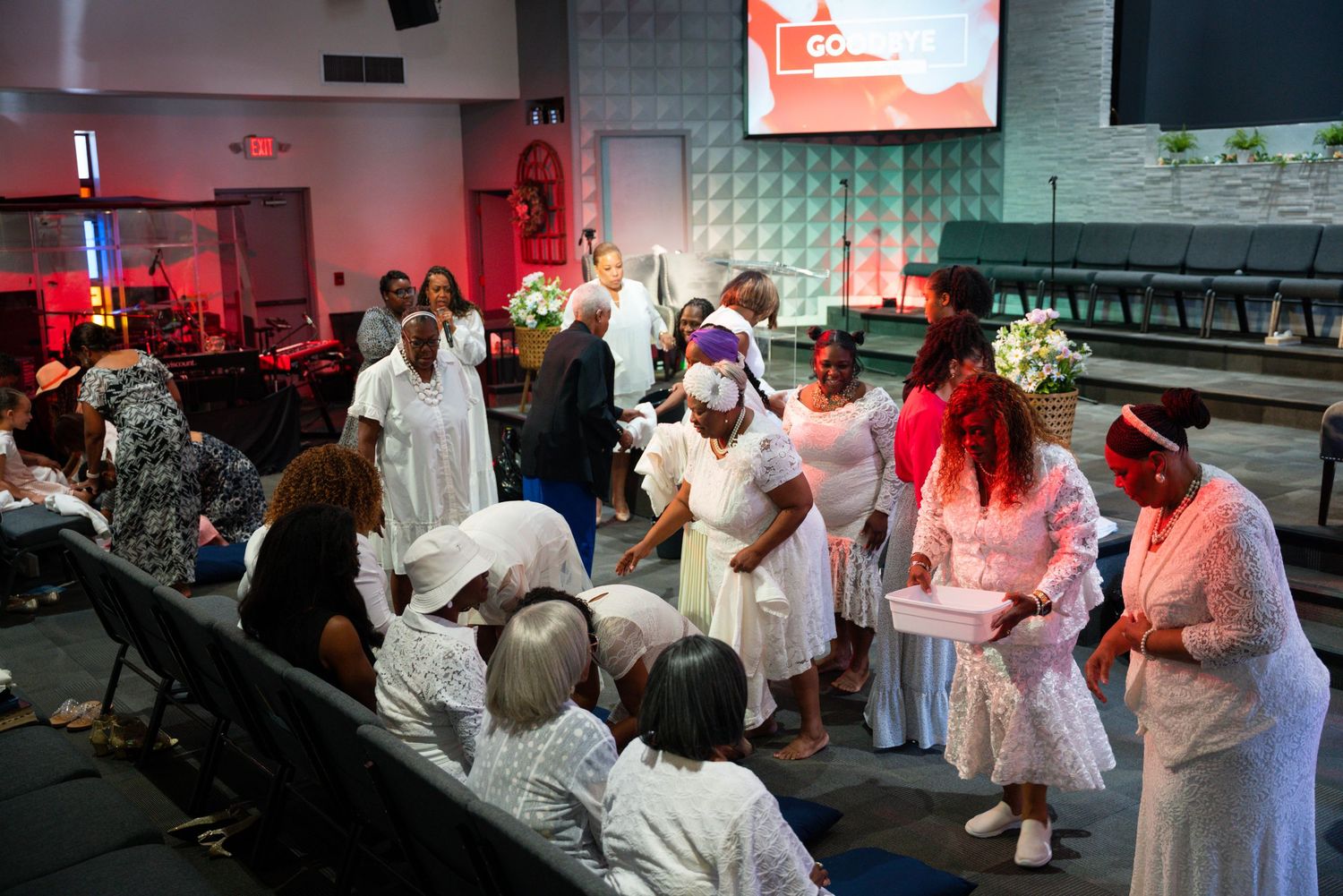 Church congregation members gather in fellowship during a lively worship service.