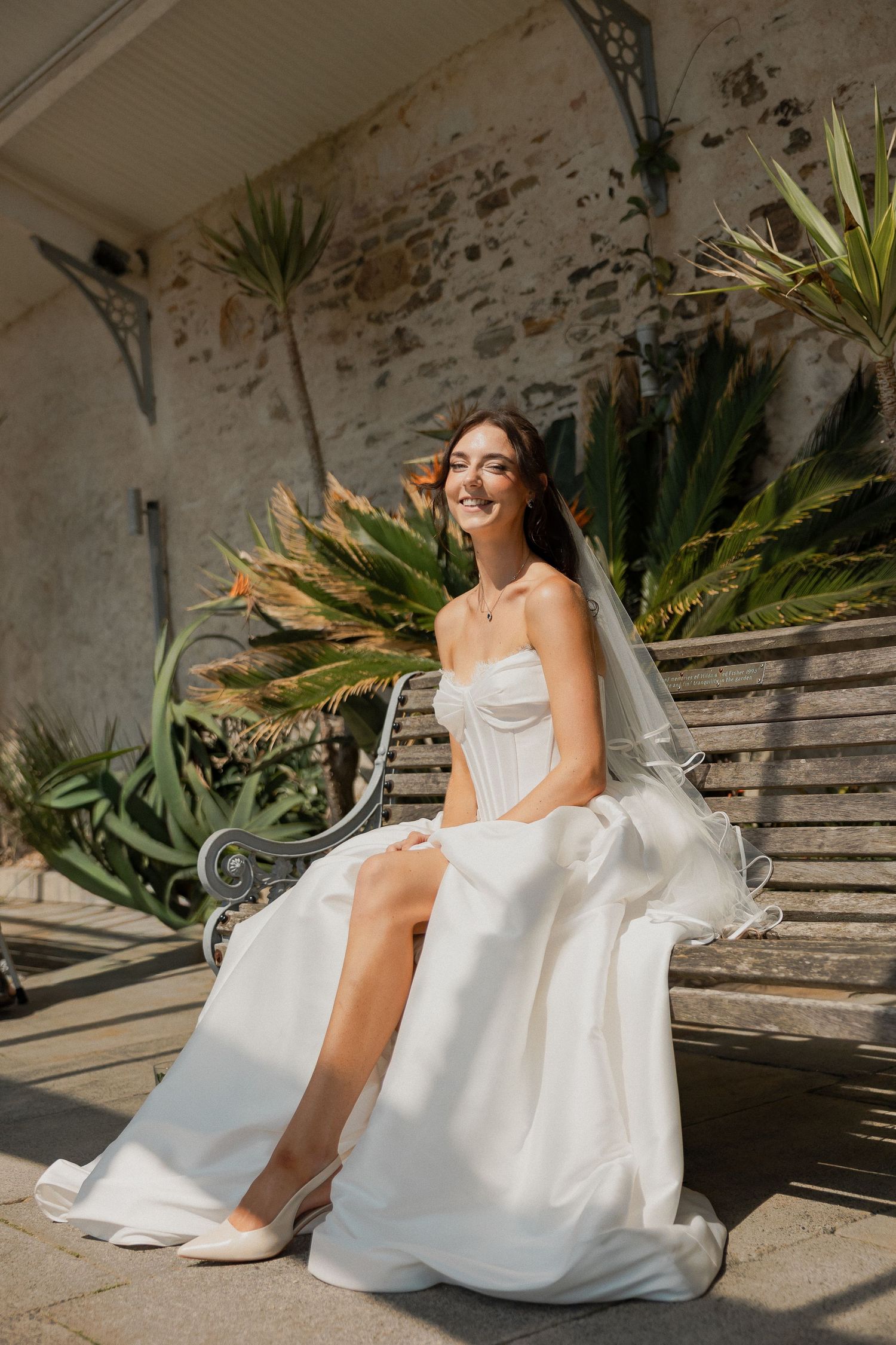 Bride sat on bench in Falmouth Cornwall