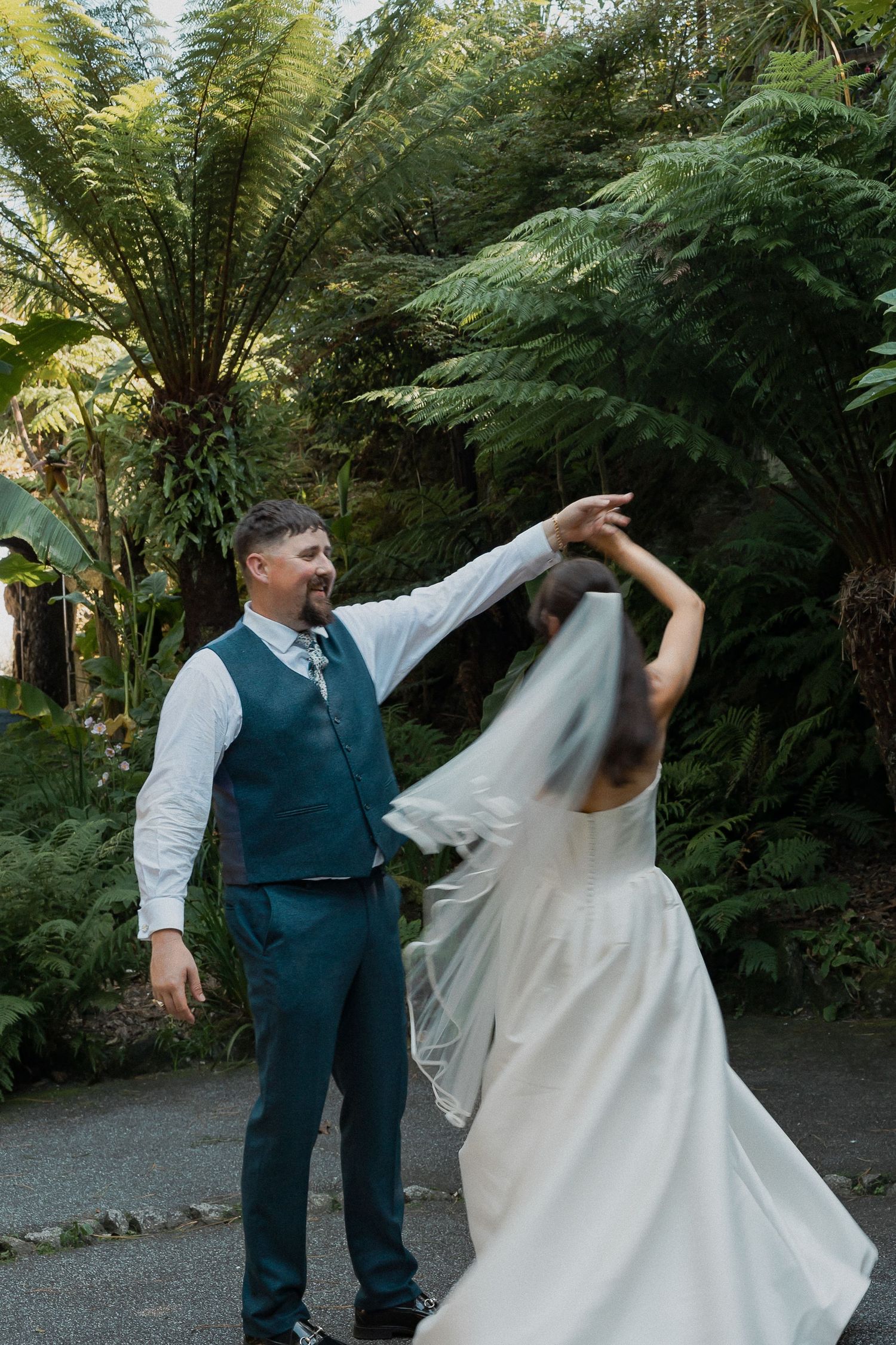 Bride and Groom dancing in gardens in Falmouth Cornwall