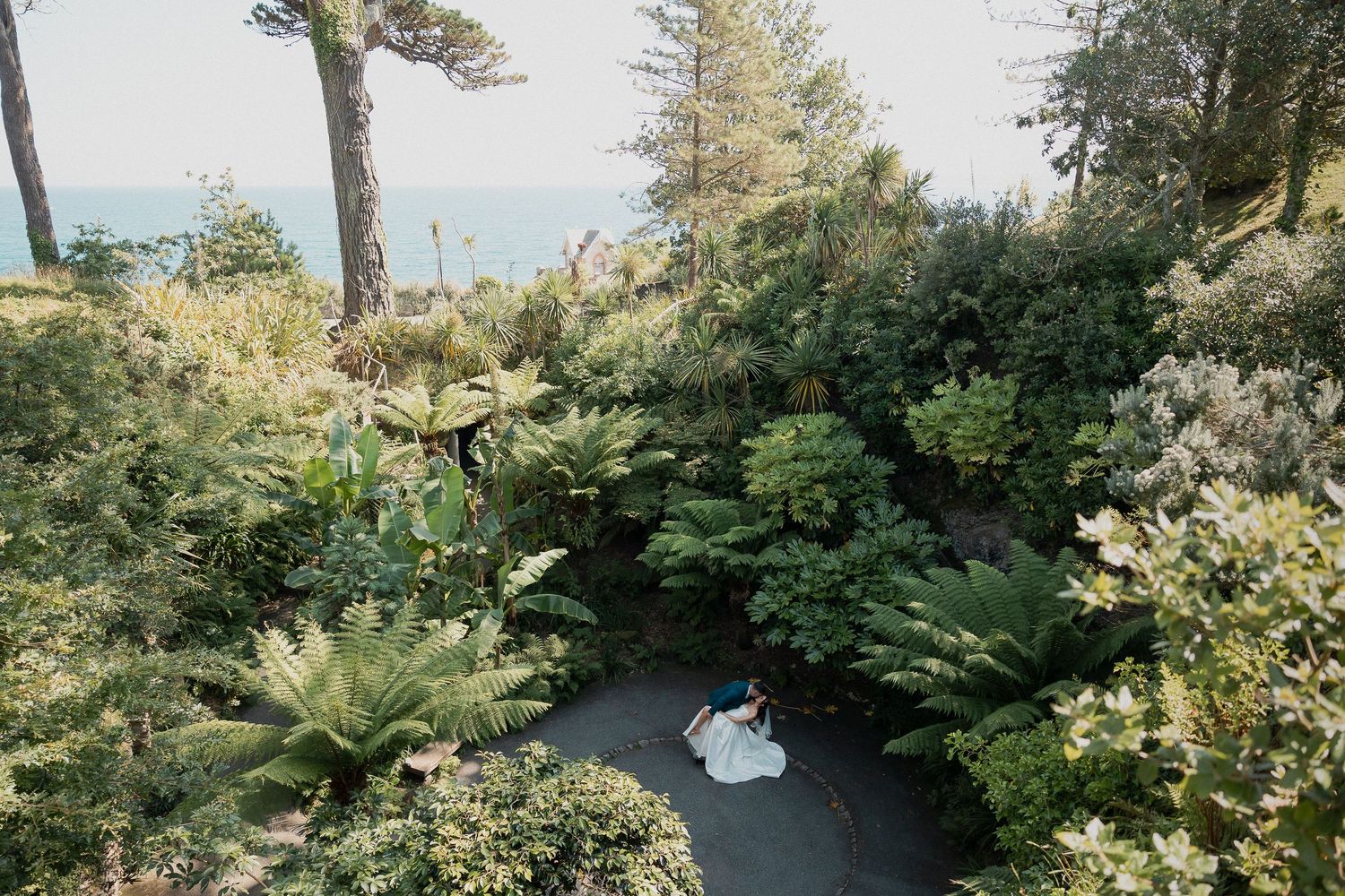 Bride and Groom kissing in tropical gardens in Falmouth, Cornwall