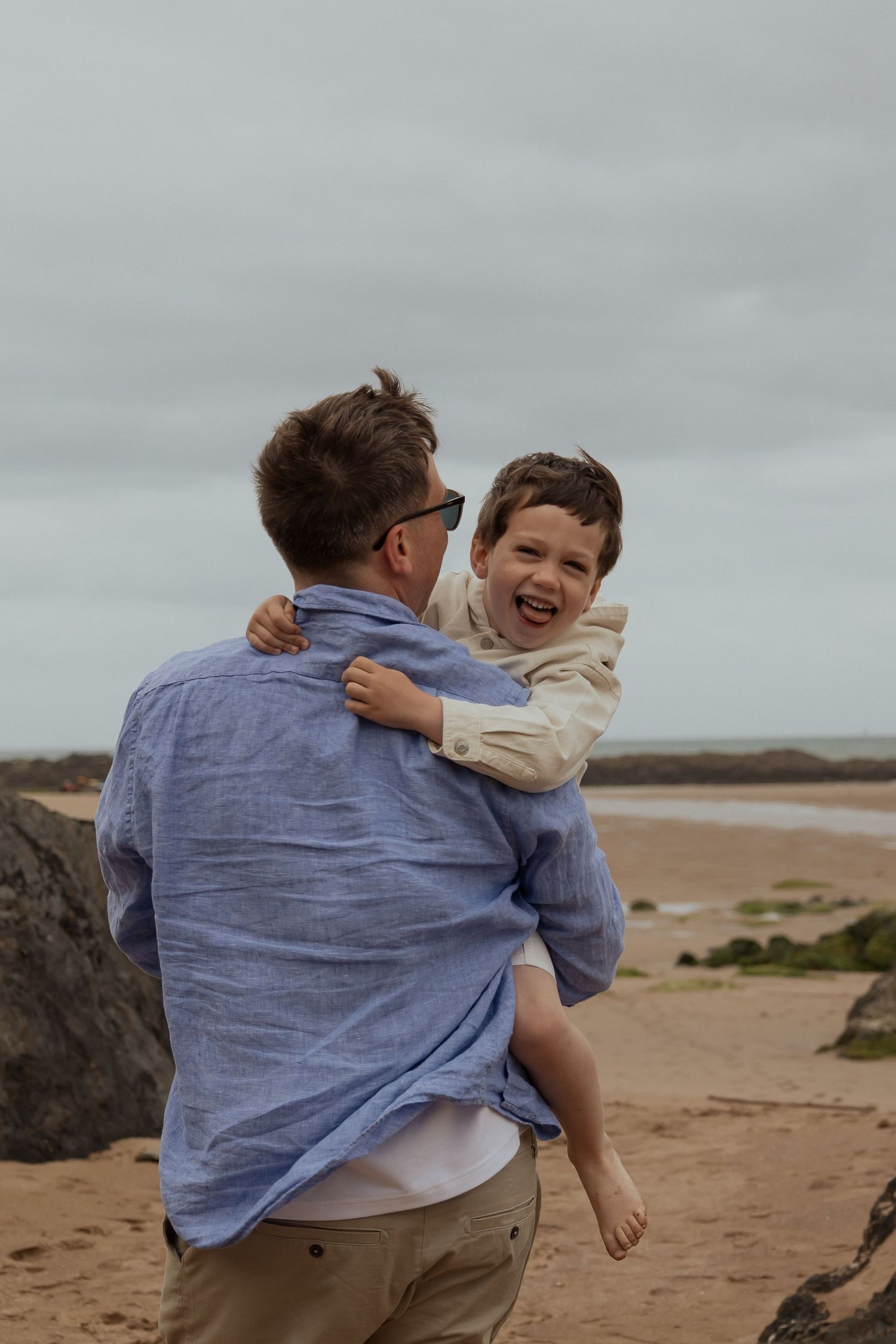 Father and Son playing during a lifestyle shoot on a South Devon beach