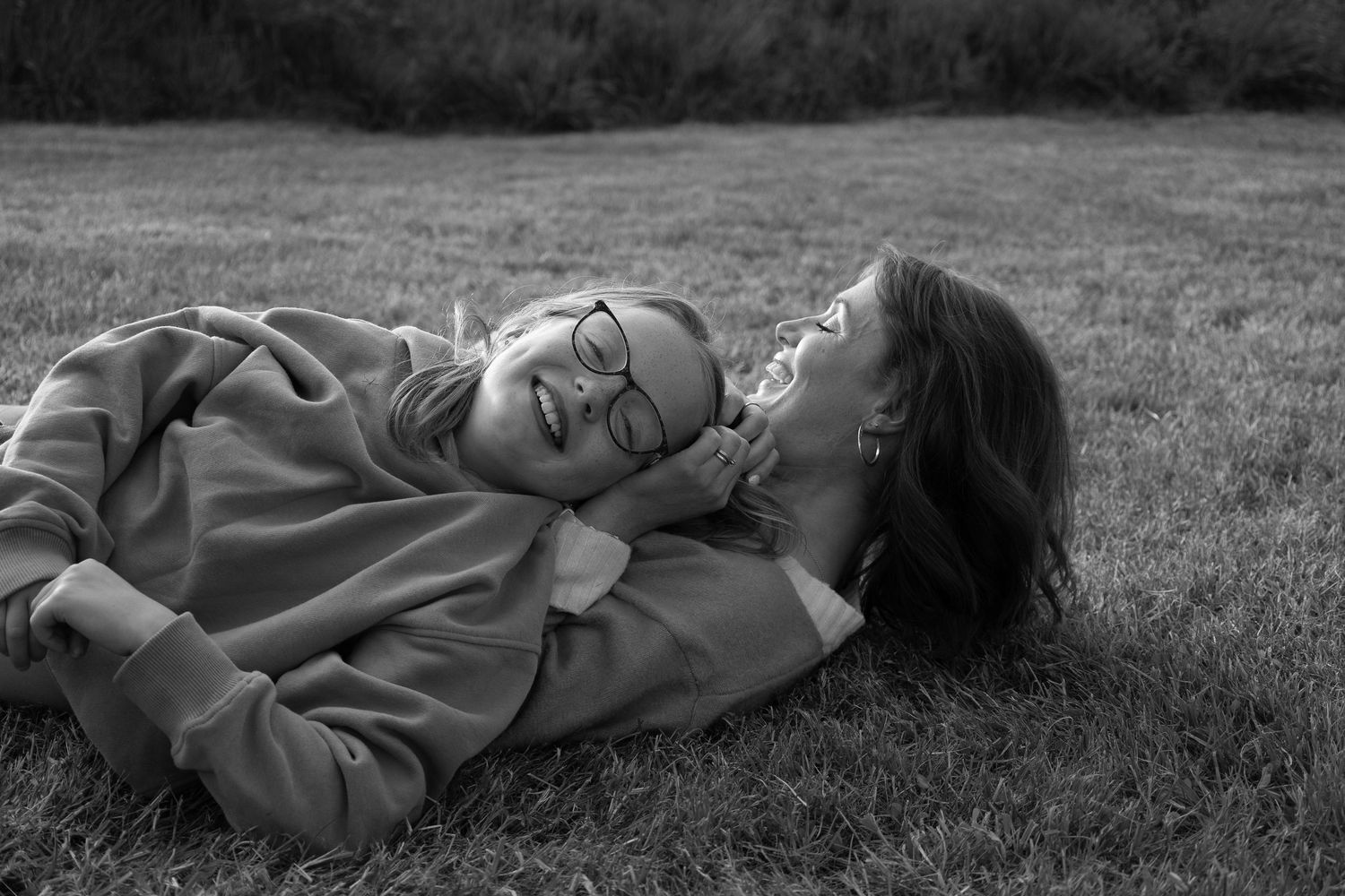 Mother and Daughter laughing during golden hour in South Devon Countryside