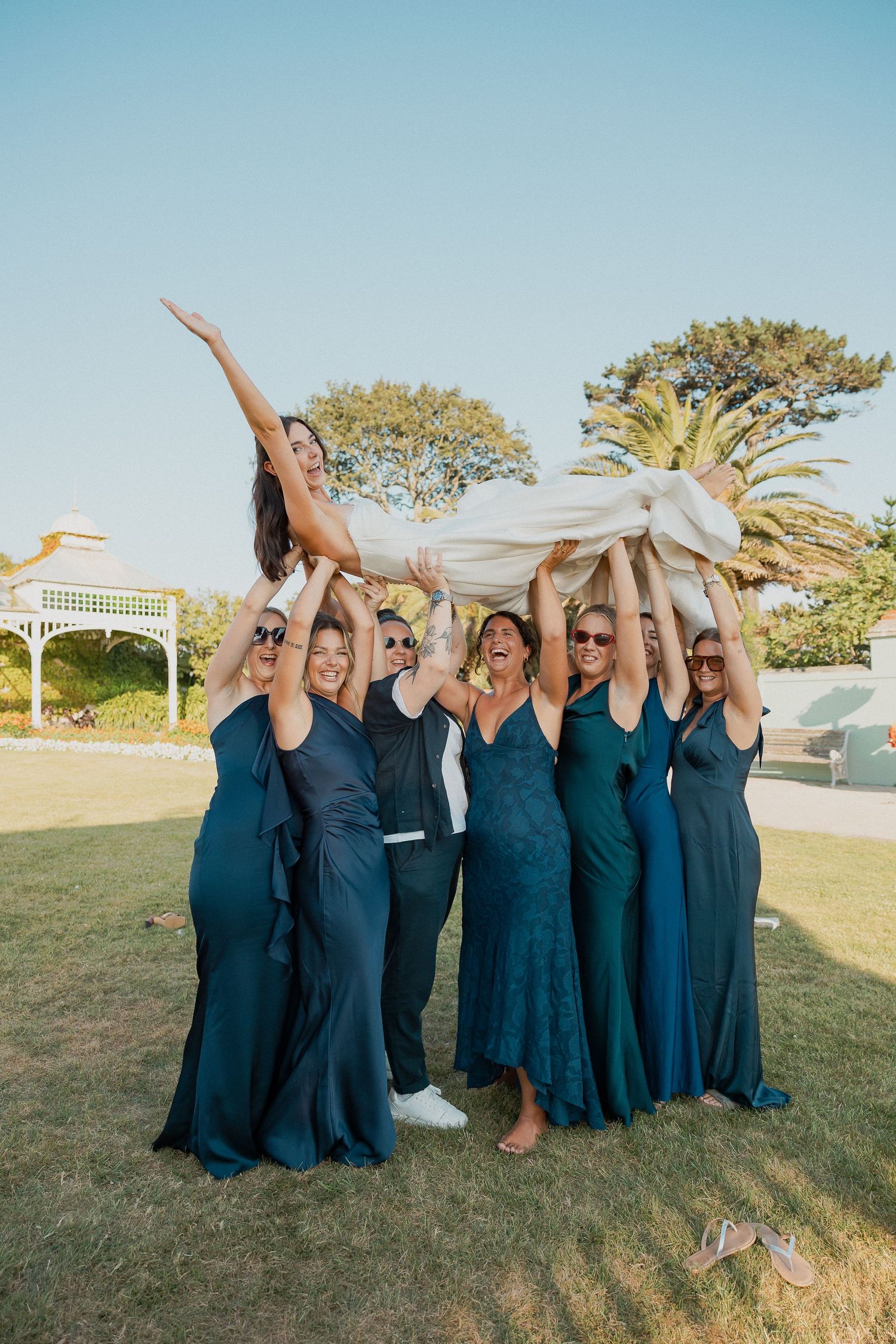 Fun Bridemaids photo with them holding up the bride in Cornwall