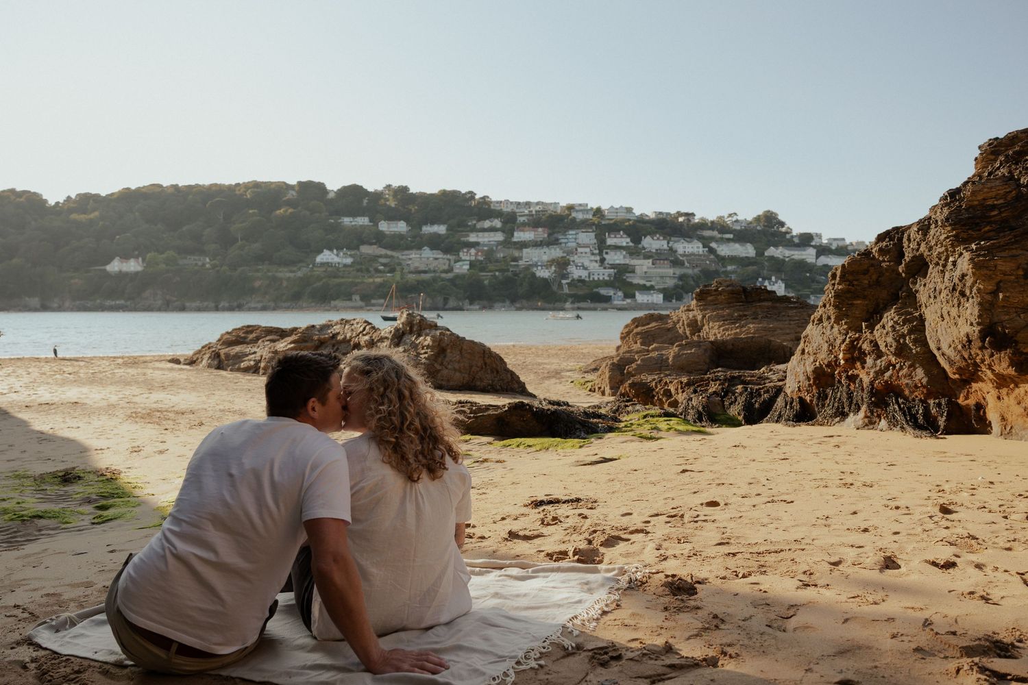 family exploring the beach with their newborn in Salcombe during a South Hams photoshoot