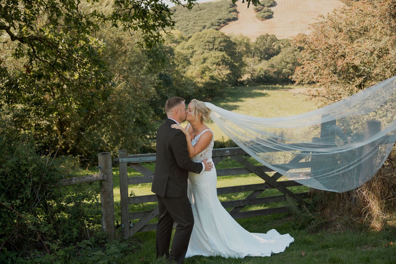 Bride and Groom kissing in Devon Countryside in Loddiswell