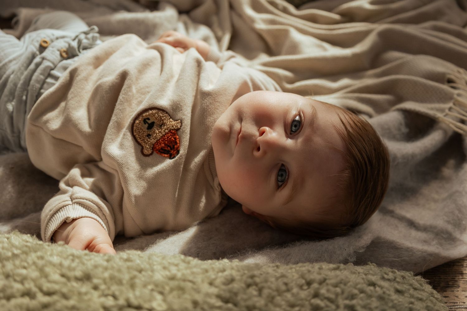 Newborn baby peacefully laying during lifestyle session in South Devon