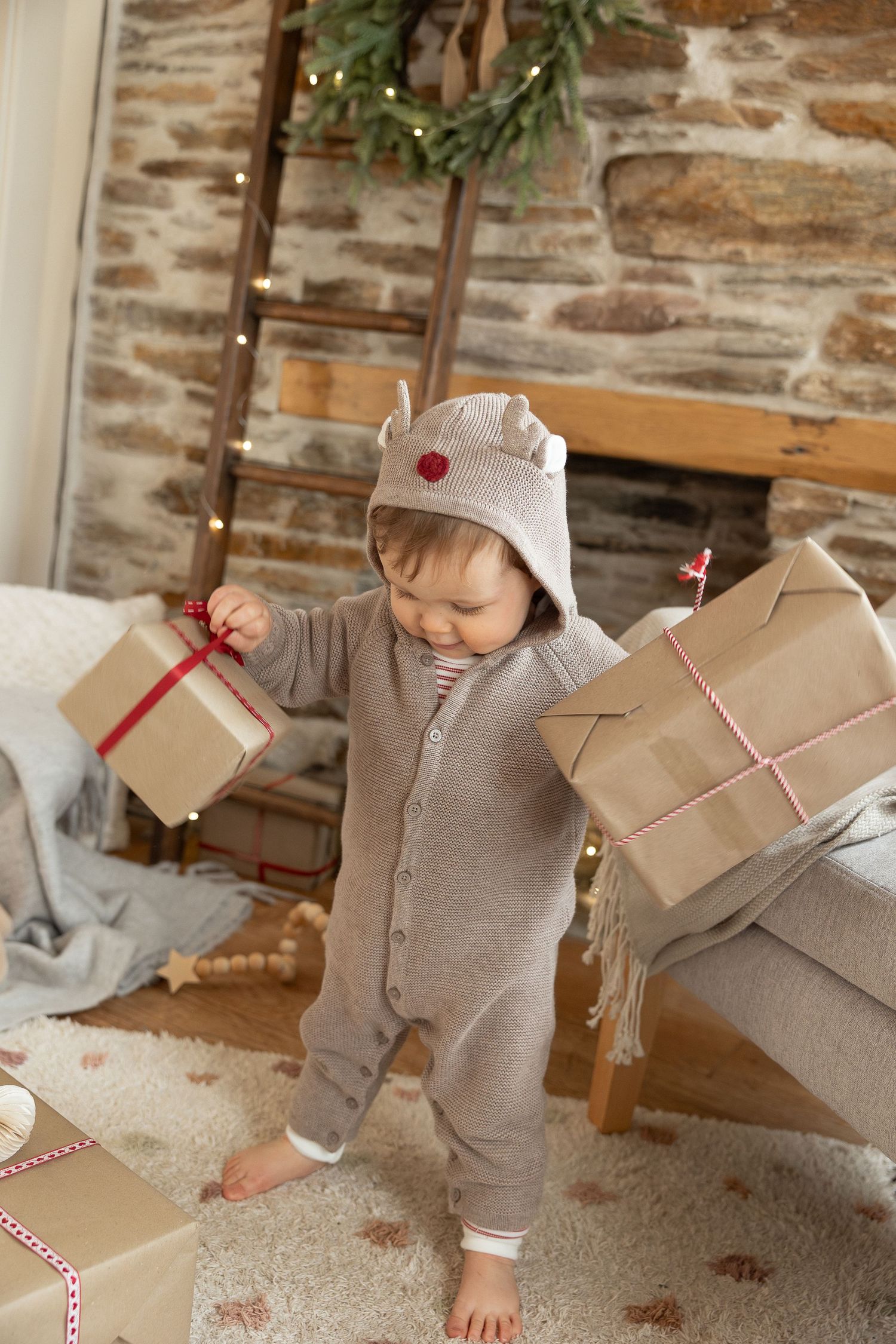 Child with presents on Christmas Mini Shoot