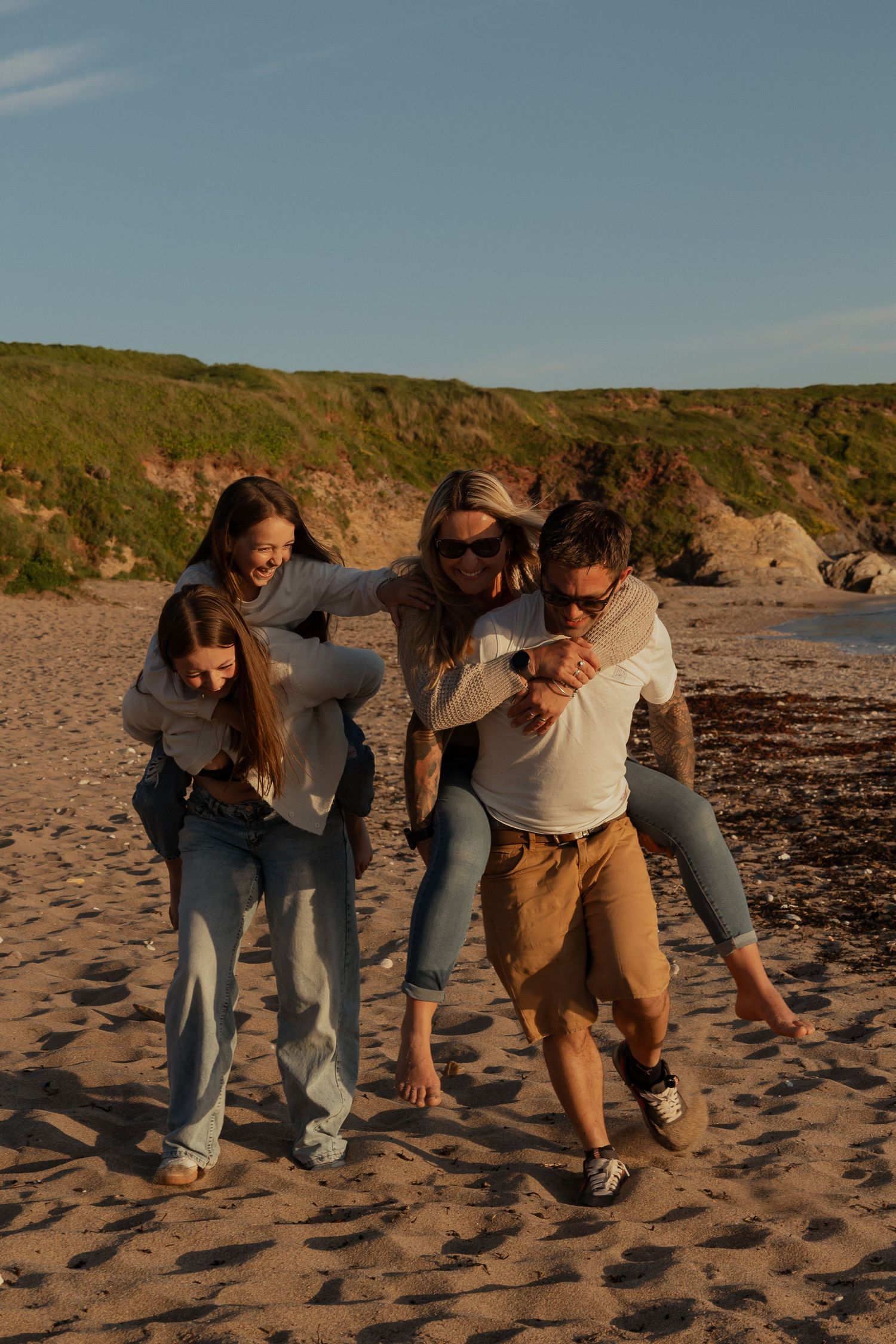 Parents and children playing together on a South Devon beach