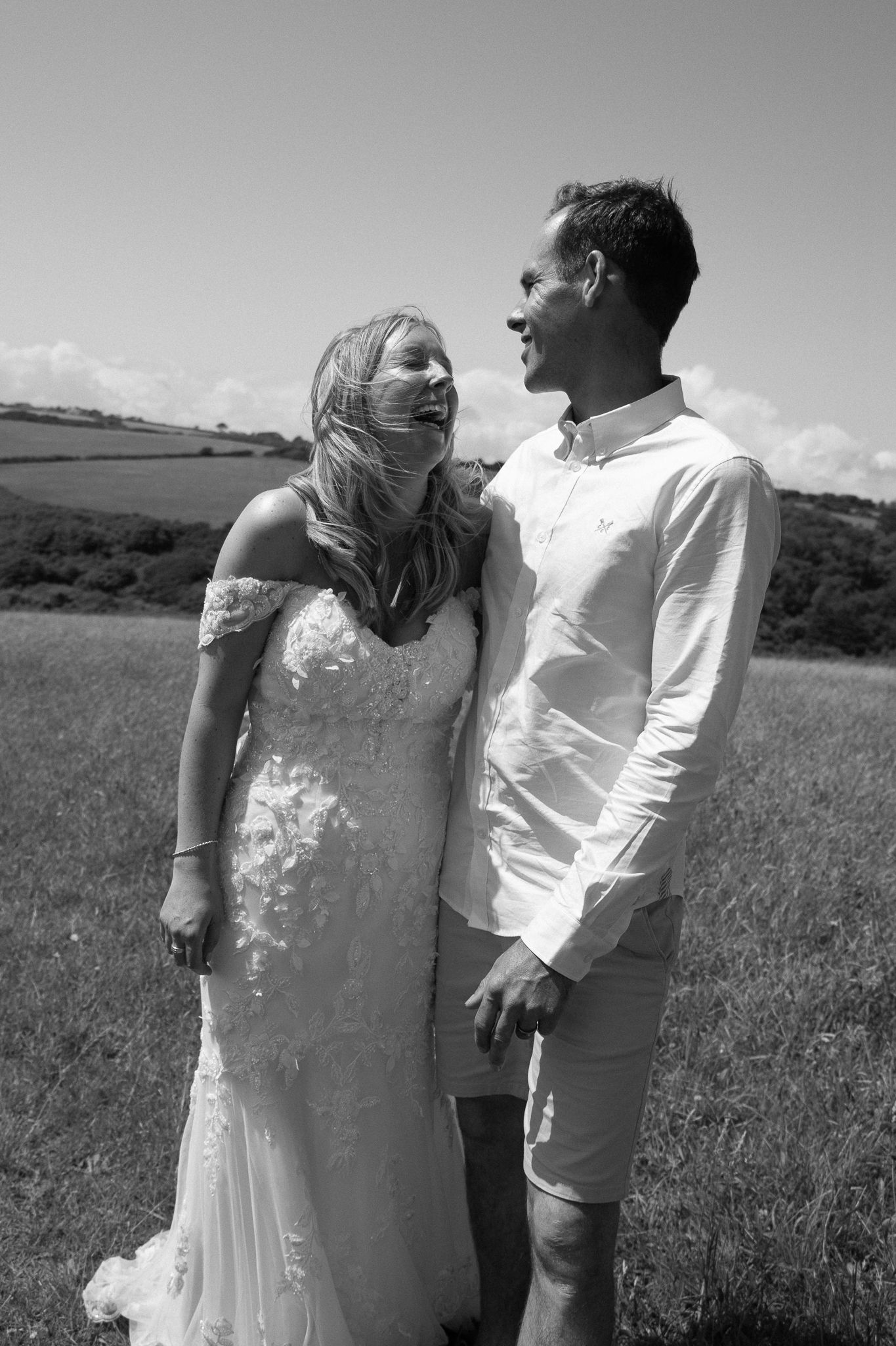Bride looking lovingly at her groom on the South Devon coast