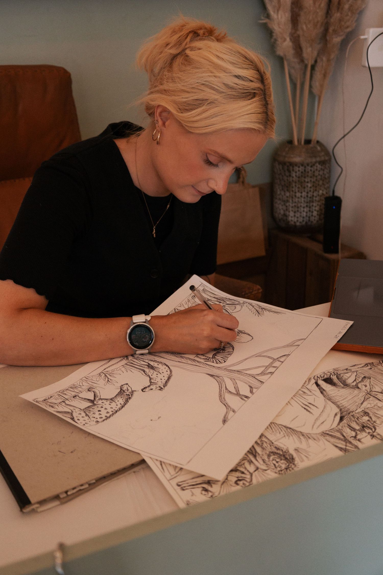 South Devon illustrator drawing in sketchbook during branding shoot