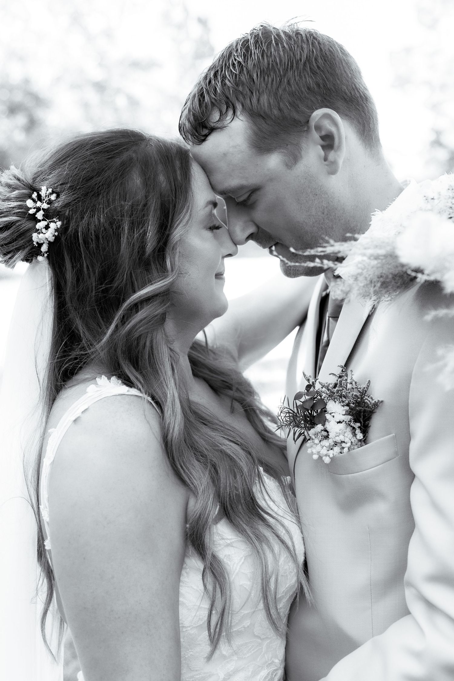 A romantic black and white wedding photo series showing tender moments between newlyweds in close-up profile views.