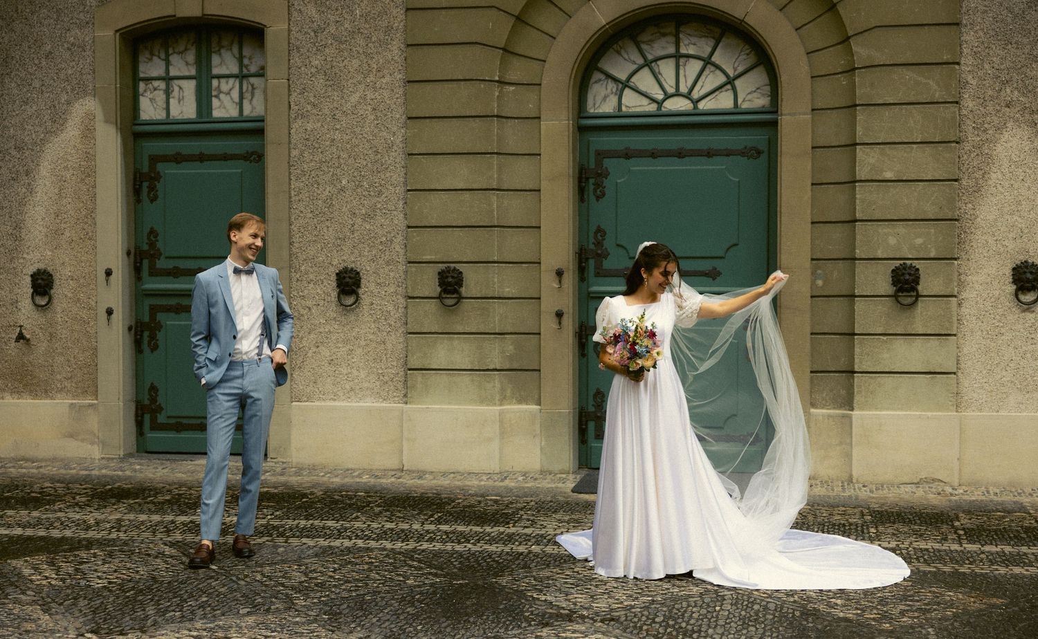 a documentary photo of a groom admiring his bride as they get ready for their ceremony on their wedding day at an old Switzerland venue