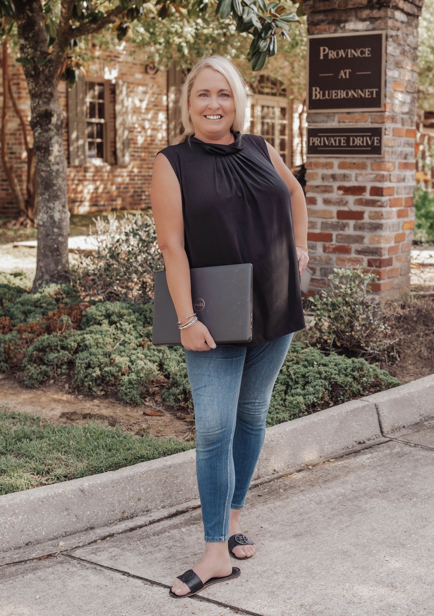 Professional branding portrait of a Baton Rouge property manager outside her office — confident, approachable, and authentic imagery.