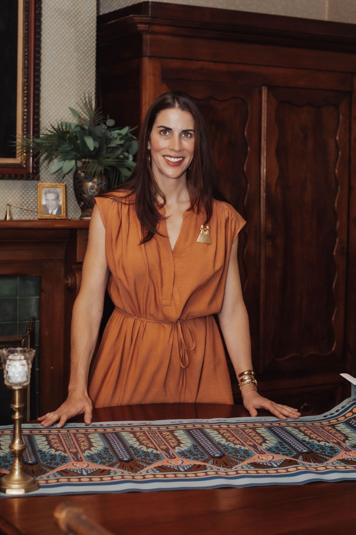 Branding portrait of a wallpaper artist at home, smiling — authentic, creative, professional imagery showcasing her craft & personality.