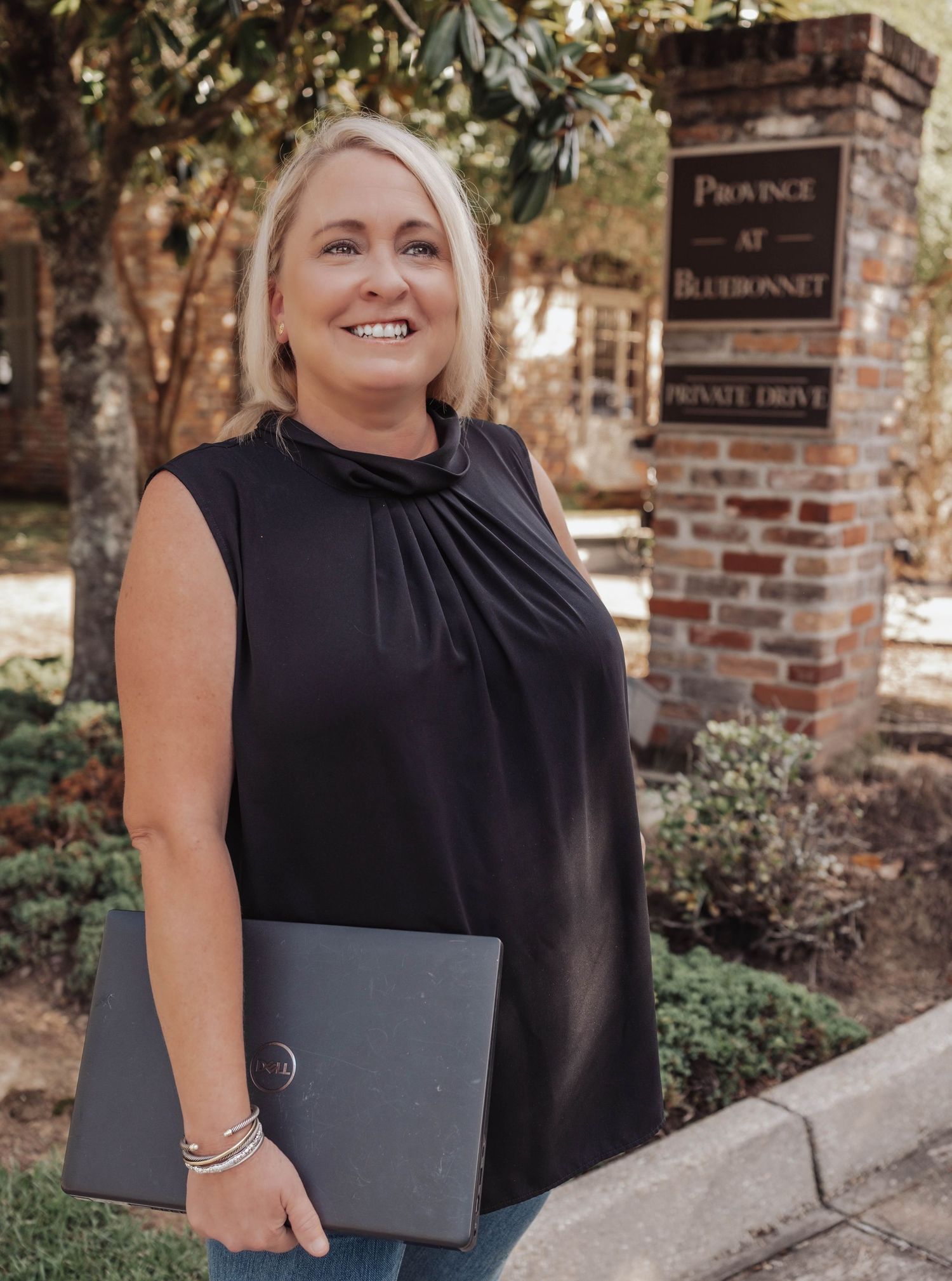 Professional branding portrait of a Baton Rouge property manager outside her office — confident, approachable, and authentic imagery.
