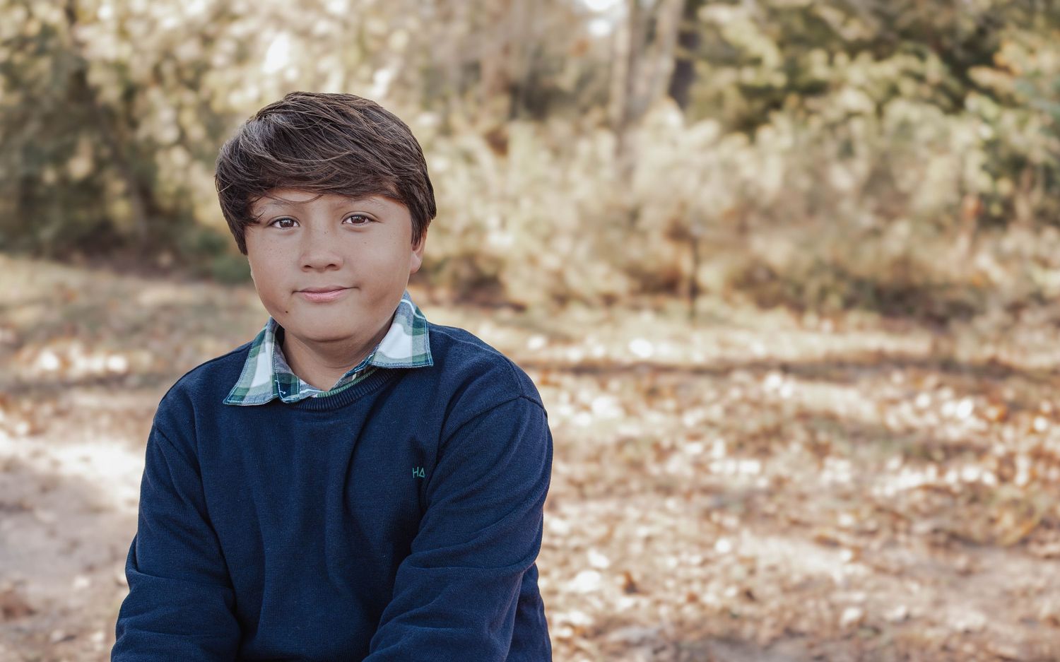 Family session in Baton Rouge during golden hour with natural light and candid connection