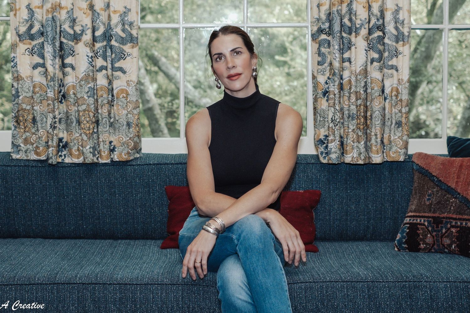 Branding portrait of a wallpaper artist at home, smiling — authentic, creative, professional imagery showcasing her craft & personality.