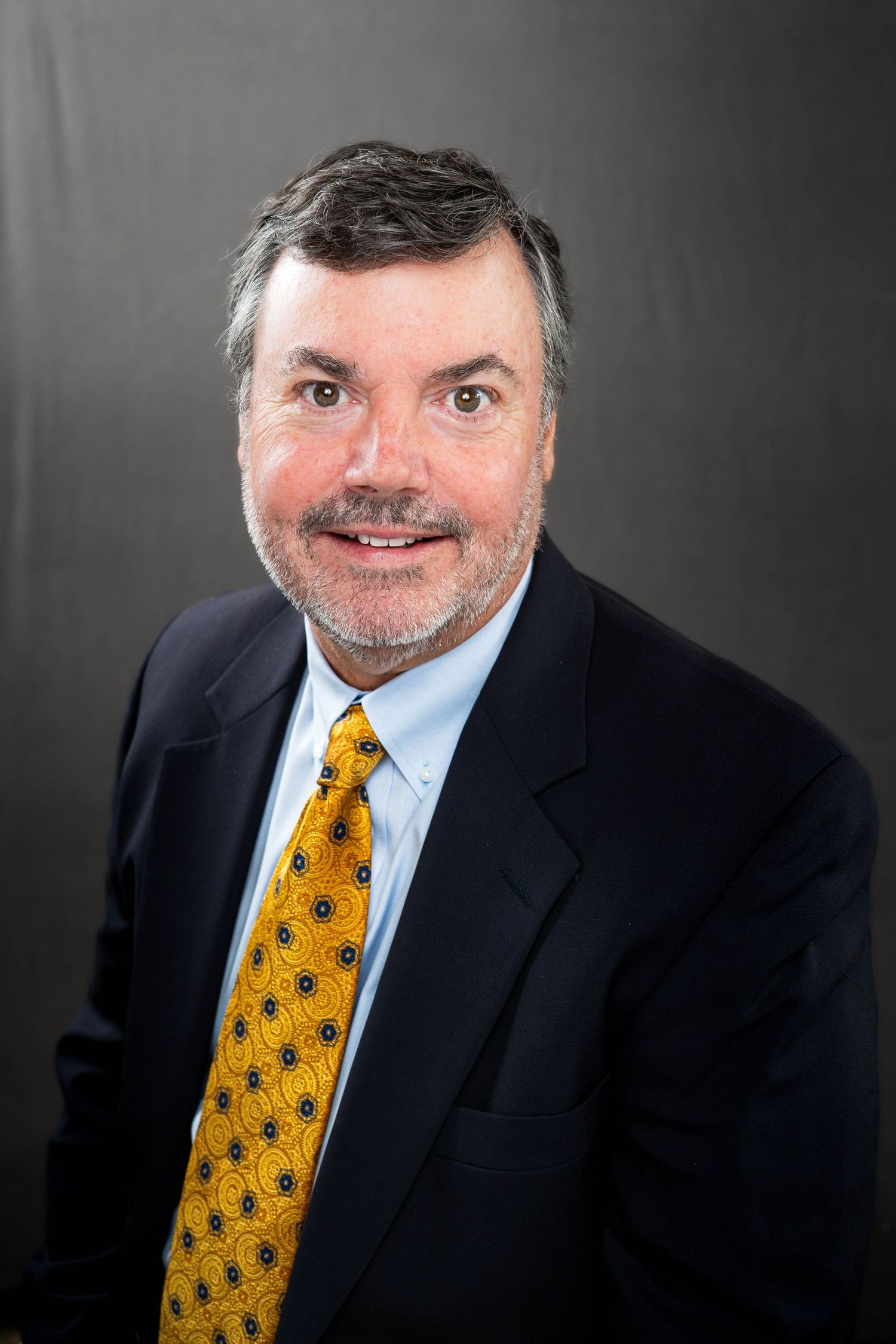 Studio headshot photographed in Baton Rouge using professional studio lighting with a clean, polished look