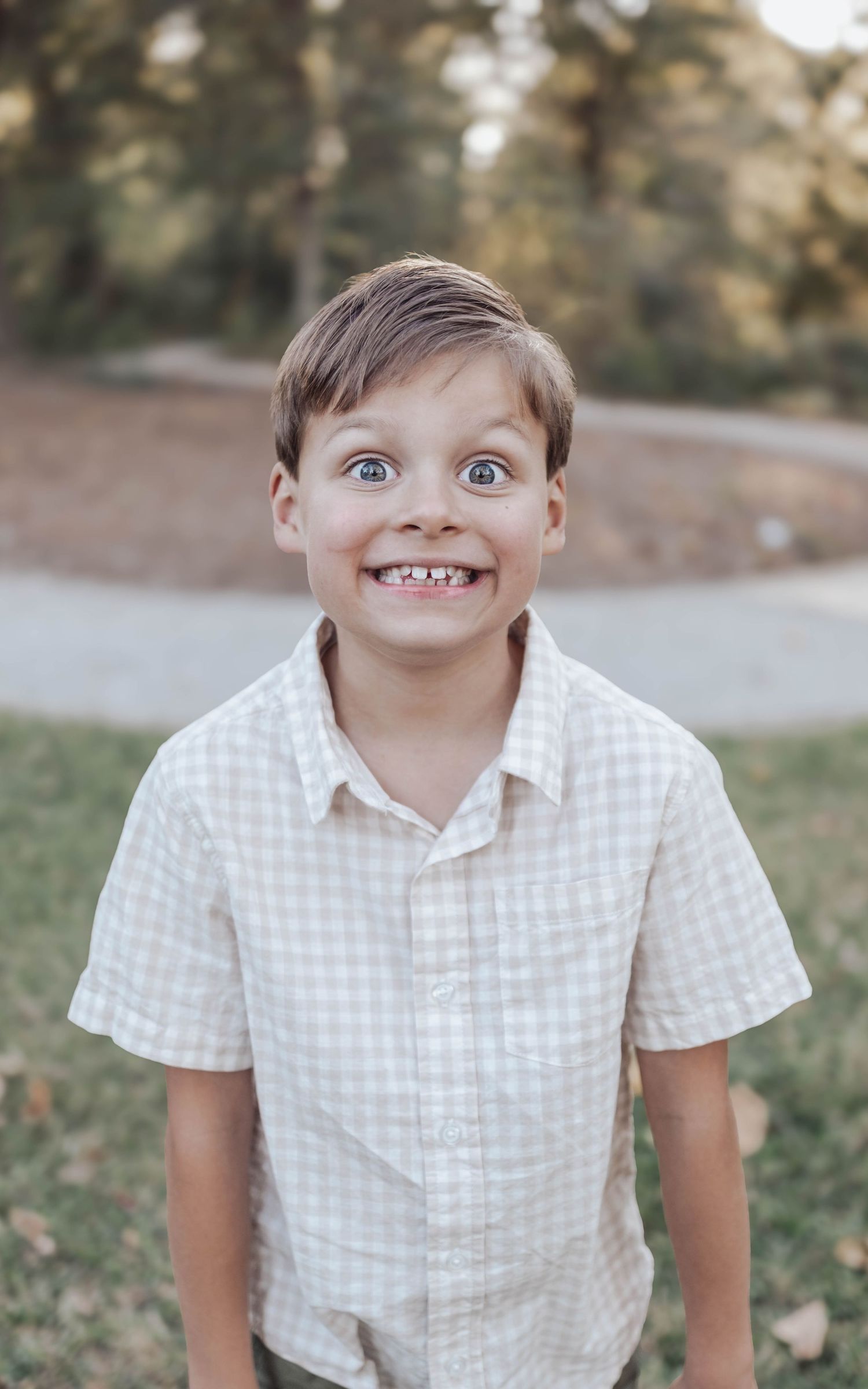 A series of playful expressions showing someone in a white checkered shirt outdoors.