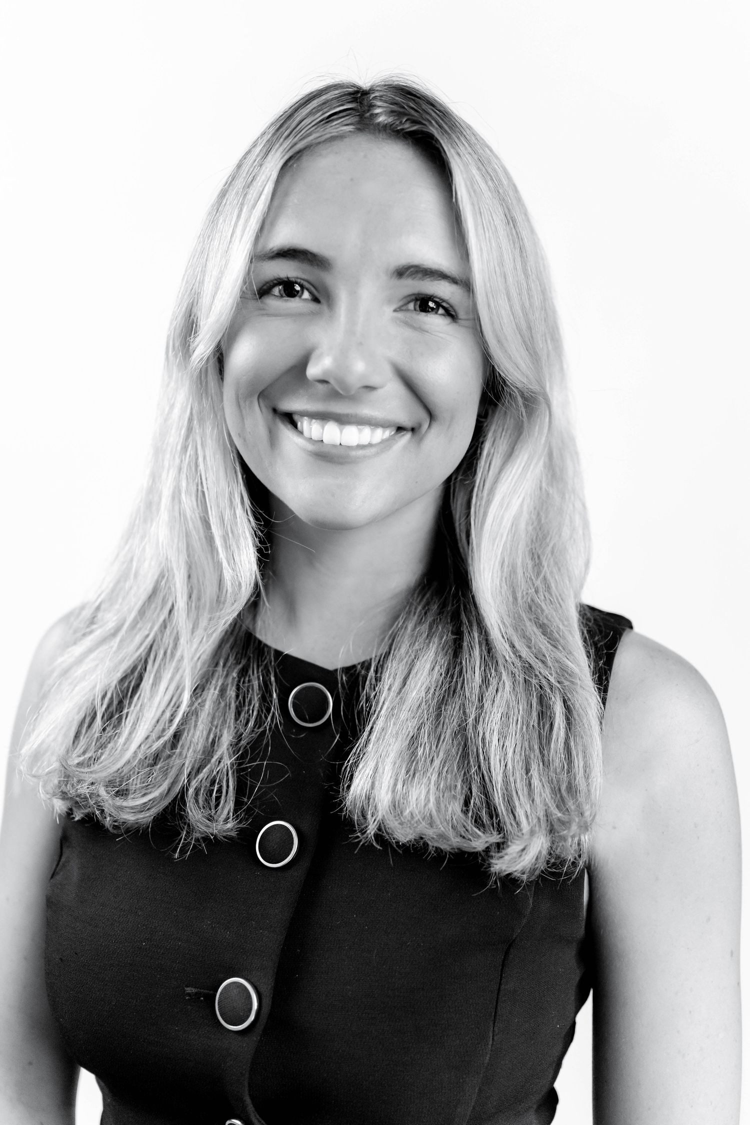 Black and white portrait series showing four expressions in a headshot style against a plain background.